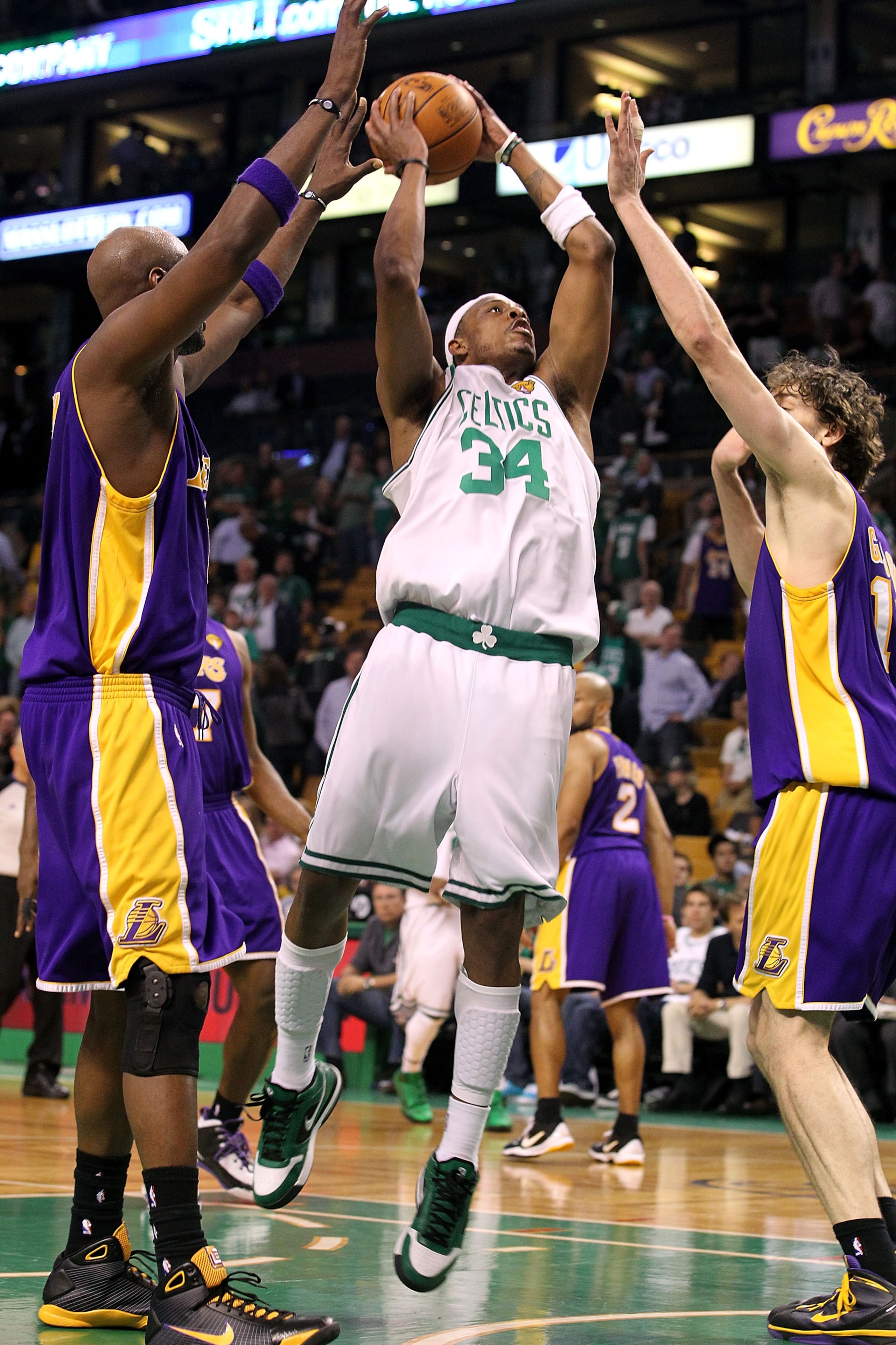 BOSTON - JUNE 08:  Paul Pierce #34 of the Boston Celtics goes up for a shot over Lamar Odom #7 and Pau Gasol #16 of the Los Angeles Lakers in Game Three of the 2010 NBA Finals on June 8, 2010 at TD Garden in Boston, Massachusetts. NOTE TO USER: User expre
