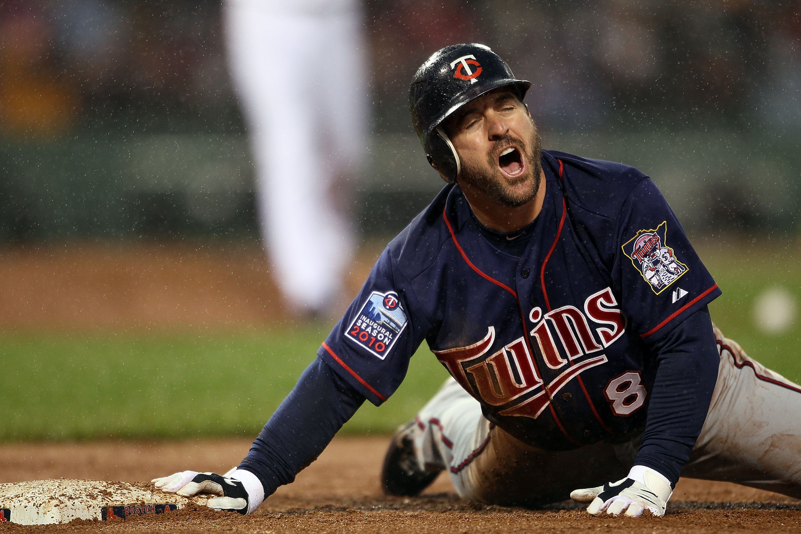 BOSTON - MAY 19:  Nick Punto #8 of the Minnesota Twins reacts after he is picked off at first base in the third inninga against the Boston Red Sox on May 19, 2010 at Fenway Park in Boston, Massachusetts.  (Photo by Elsa/Getty Images)
