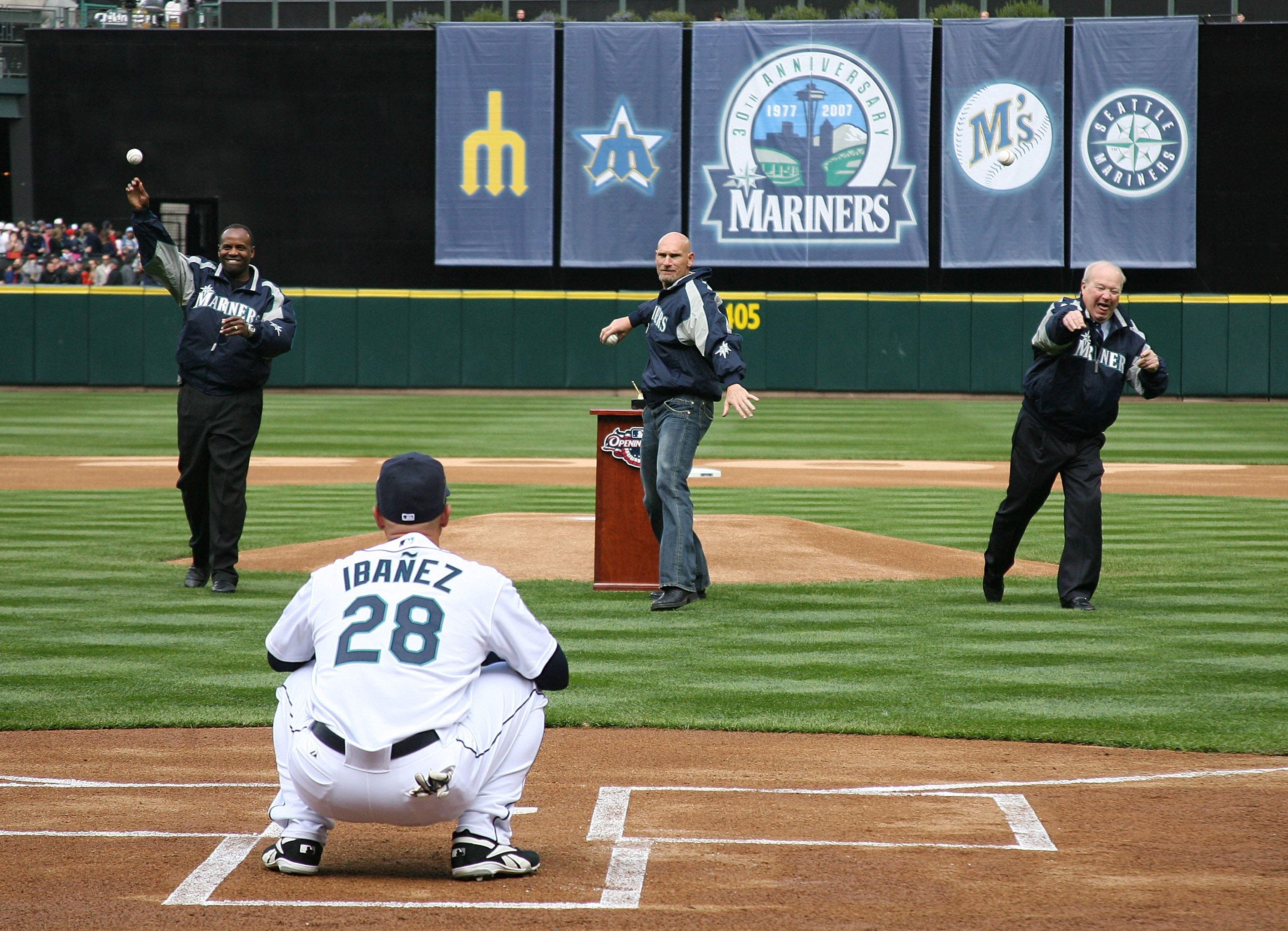 SEATTLE - APRIL 2: (L-R) Former Mariners Alvin Davis, Jay Buhner, and team announcer Dave Niehaus of the Seattle Mariners throw out the ceremonial first pitch of the game on opening day against the Oakland A's at Safeco Field April 2, 2007 in Seattle, Wa
