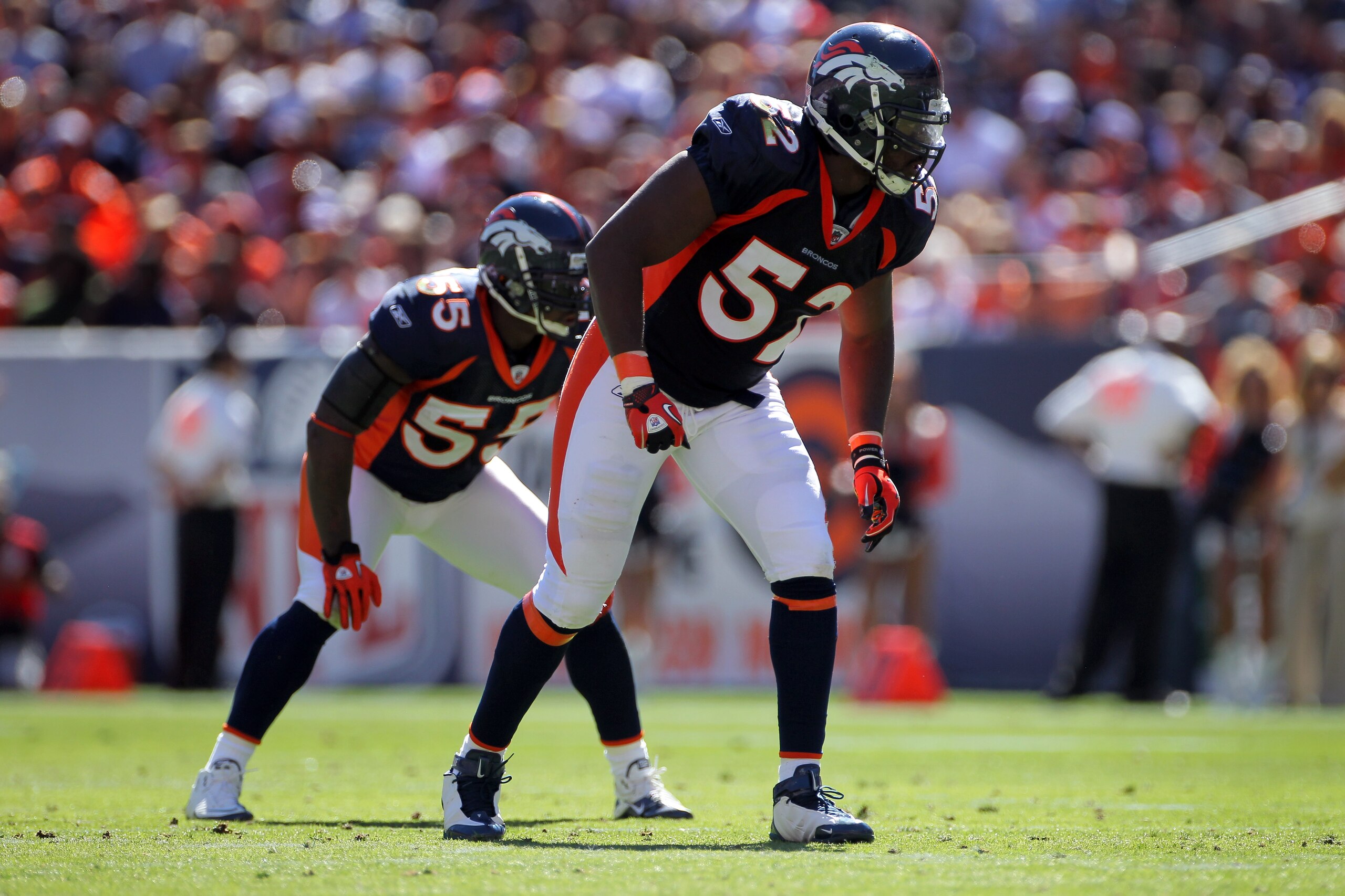 DENVER - SEPTEMBER 19:  Linebackers Jason Hunter #52 and D.J. Williams #55 of the Denver Broncos are ready for action against the Seattle Seahawks at INVESCO Field at Mile High on September 19, 2010 in Denver, Colorado. The Broncos defeated the Seahawks 3
