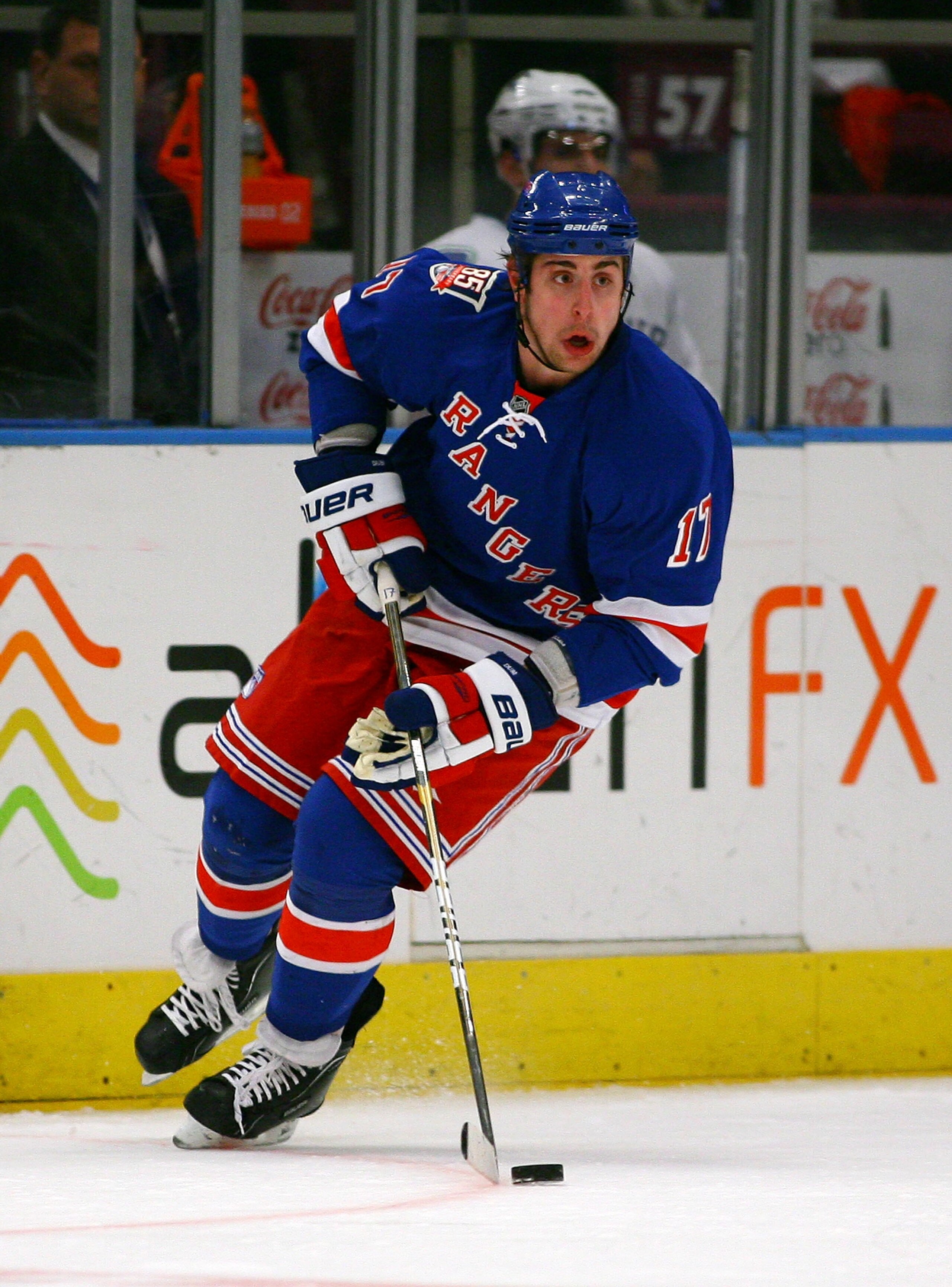 NEW YORK , NY - JANUARY 13: Brandon Dubinsky #17 of the New York Rangers plays the puck against the Vancouver Canucks during the game at Madison Square Garden on January 13, 2011 in New York City. (Photo by Andy Marlin/Getty Images)