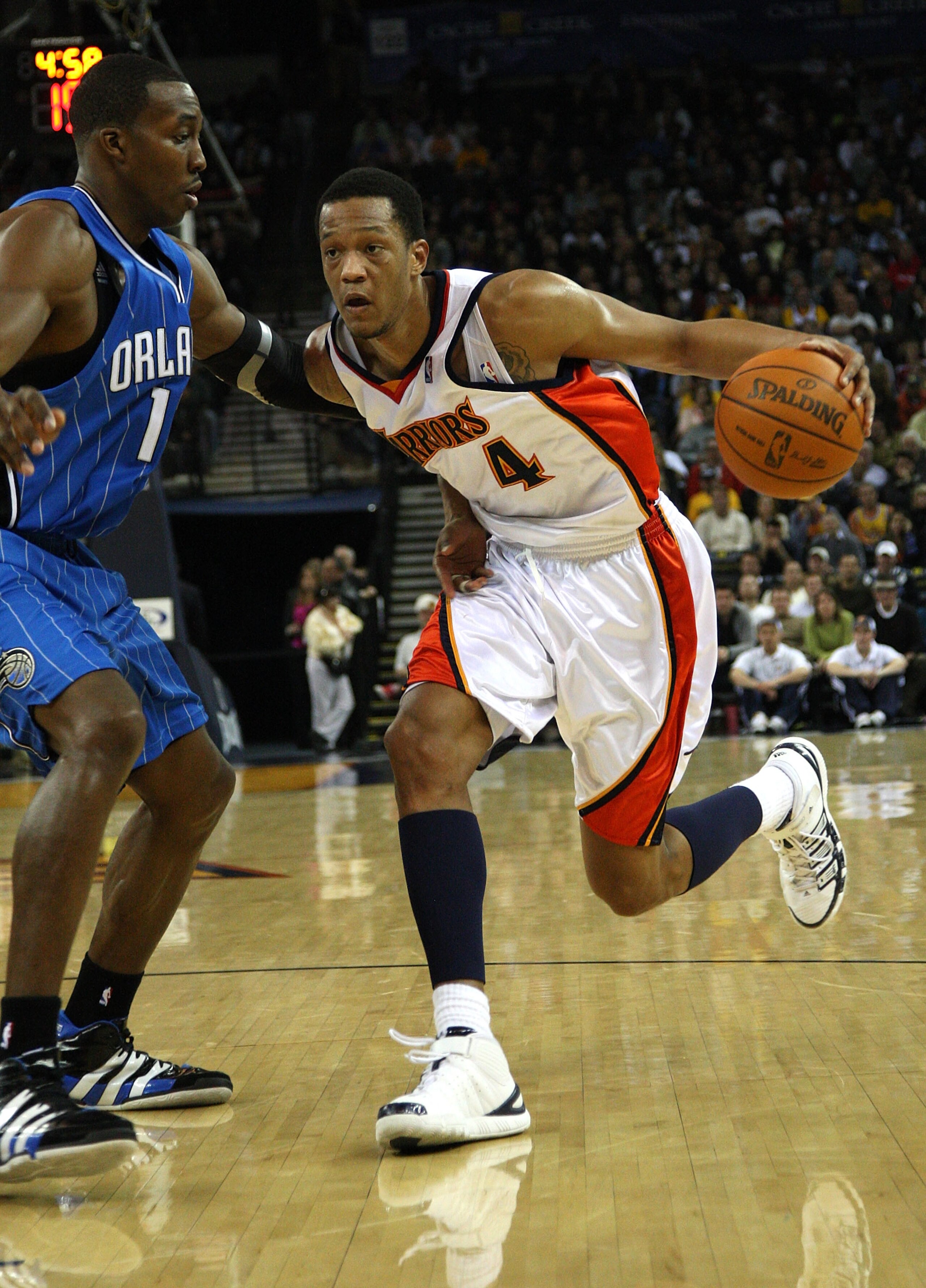 OAKLAND, CA - DECEMBER 05:  Anthony Randolph #4 of the Golden State Warriors drives against Dwight Howard #12 of the Orlando Magic during an NBA game at Oracle Arena on December 5, 2009 in Oakland, California. NOTE TO USER: User expressly acknowledges and