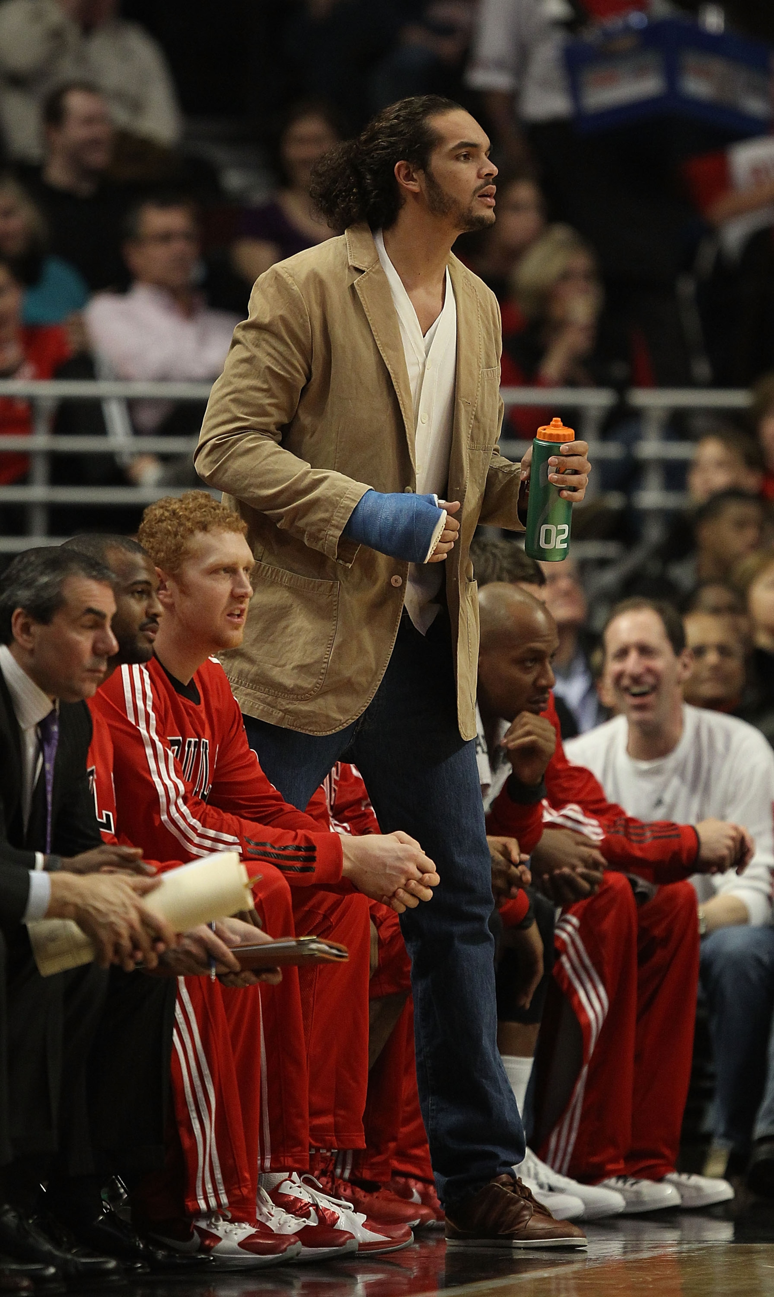 CHICAGO, IL - DECEMBER 21: Injured player Joakim Noah of the Chicago Bulls watches as his teammates take on the Philadelphia 76ers at the United Center on December 21, 2010 in Chicago, Illinois. The Bulls defeated the 76ers 121-76. NOTE TO USER: User expr