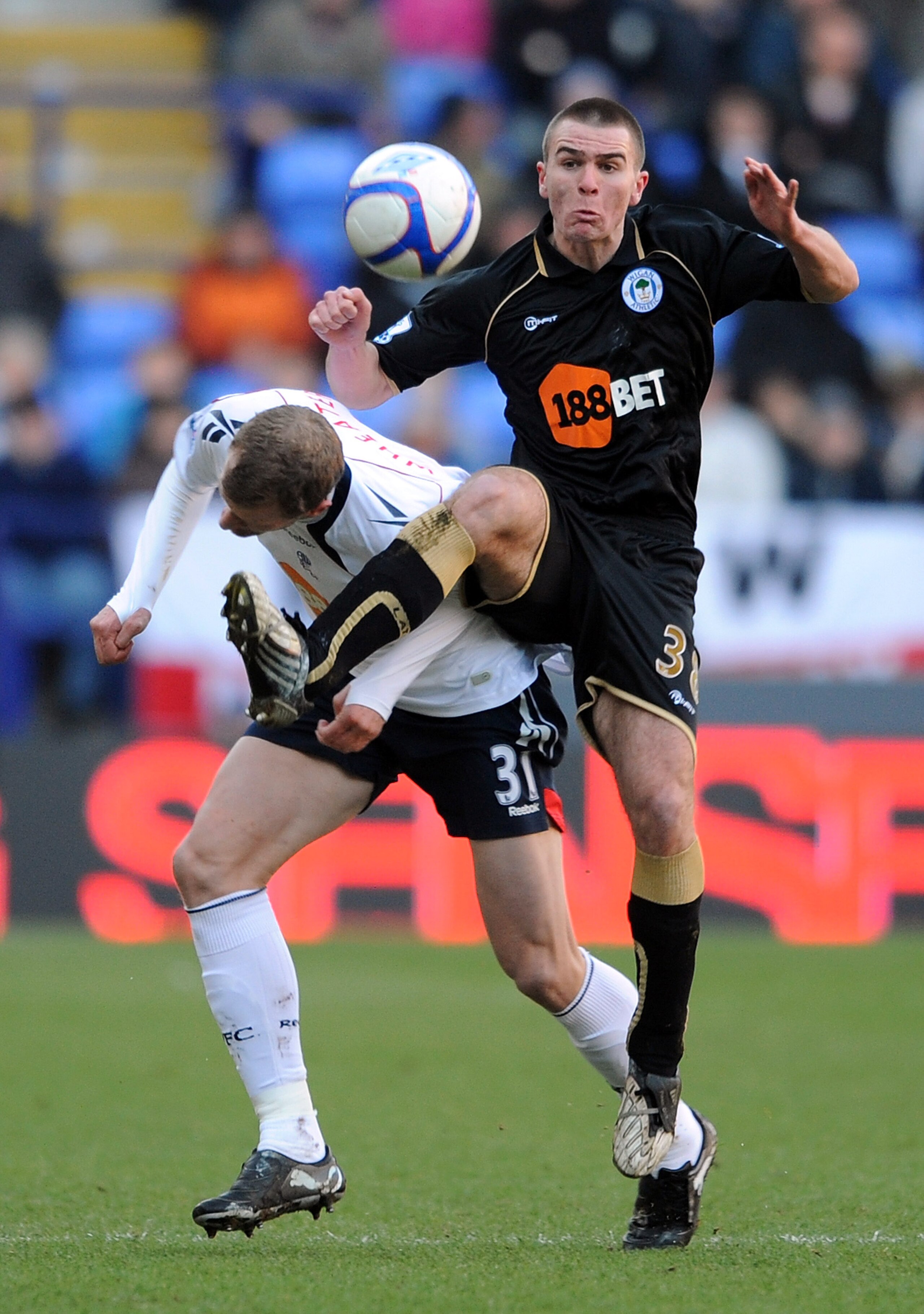 BOLTON, ENGLAND - JANUARY 29: David Wheater of Bolton Wanderers competes with Callum McManaman of Wigan Athletic during the FA Cup sponsored by E.ON 4th Round match between Bolton Wanderers and Wigan Athletic on January 29, 2011 in Bolton, England.  (Phot