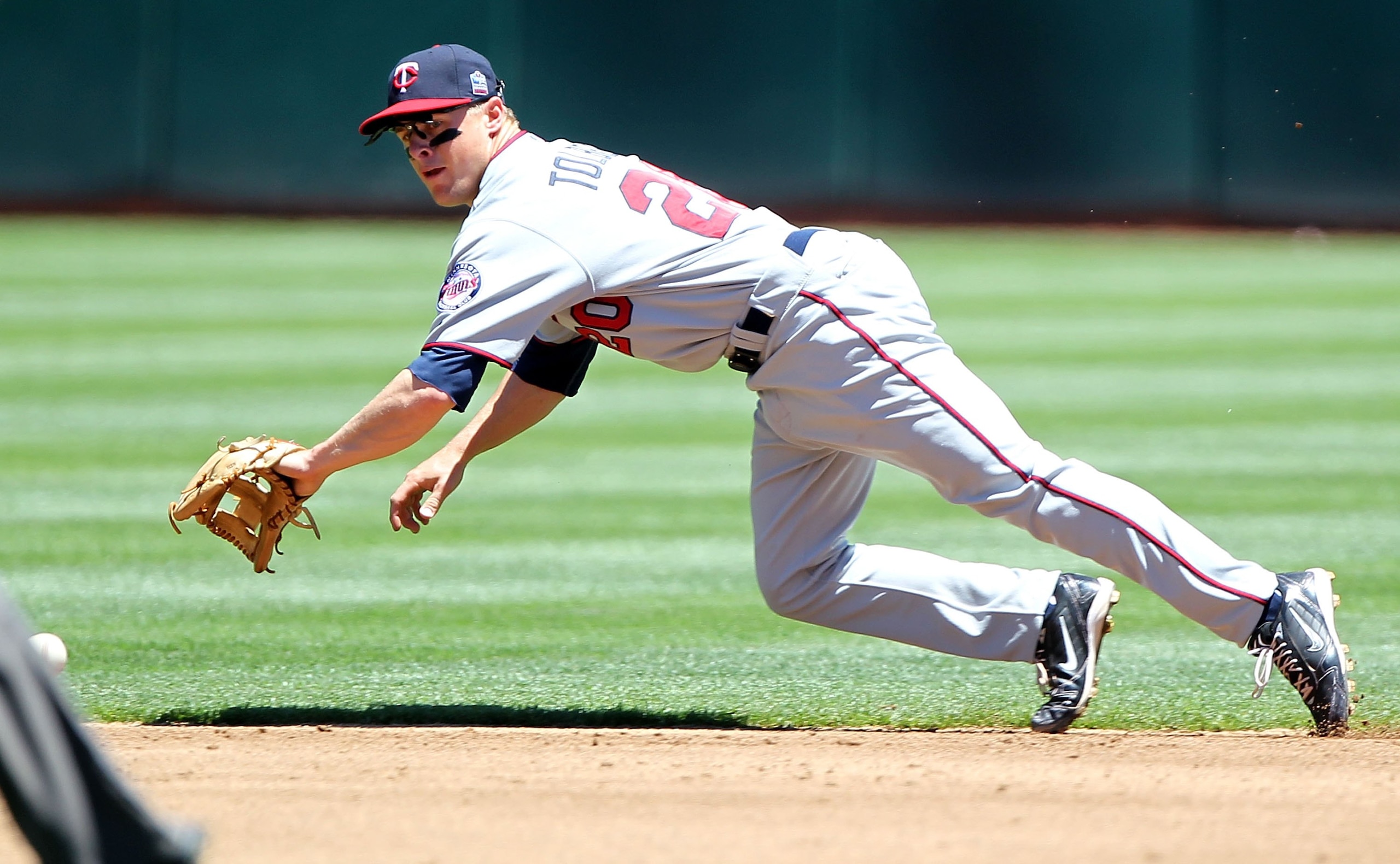 OAKLAND, CA - JUNE 06:  Matt Tolbert #20 of the Minnesota Twins in action against the Oakland Athletics during an MLB game at the Oakland-Alameda County Coliseum on June 6, 2010 in Oakland, California.  (Photo by Jed Jacobsohn/Getty Images)