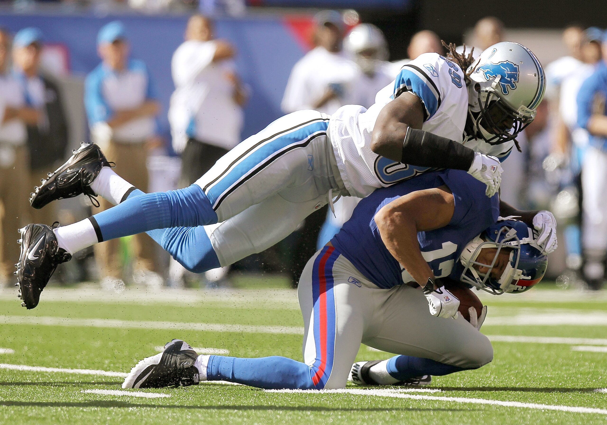 EAST RUTHERFORD, NJ - OCTOBER 17: Steve Smith #12 of the New York Giants is tackled by C.C. Brown #39 of the Detroit Lions at New Meadowlands Stadium on October 17, 2010 in East Rutherford, New Jersey.  (Photo by Nick Laham/Getty Images)