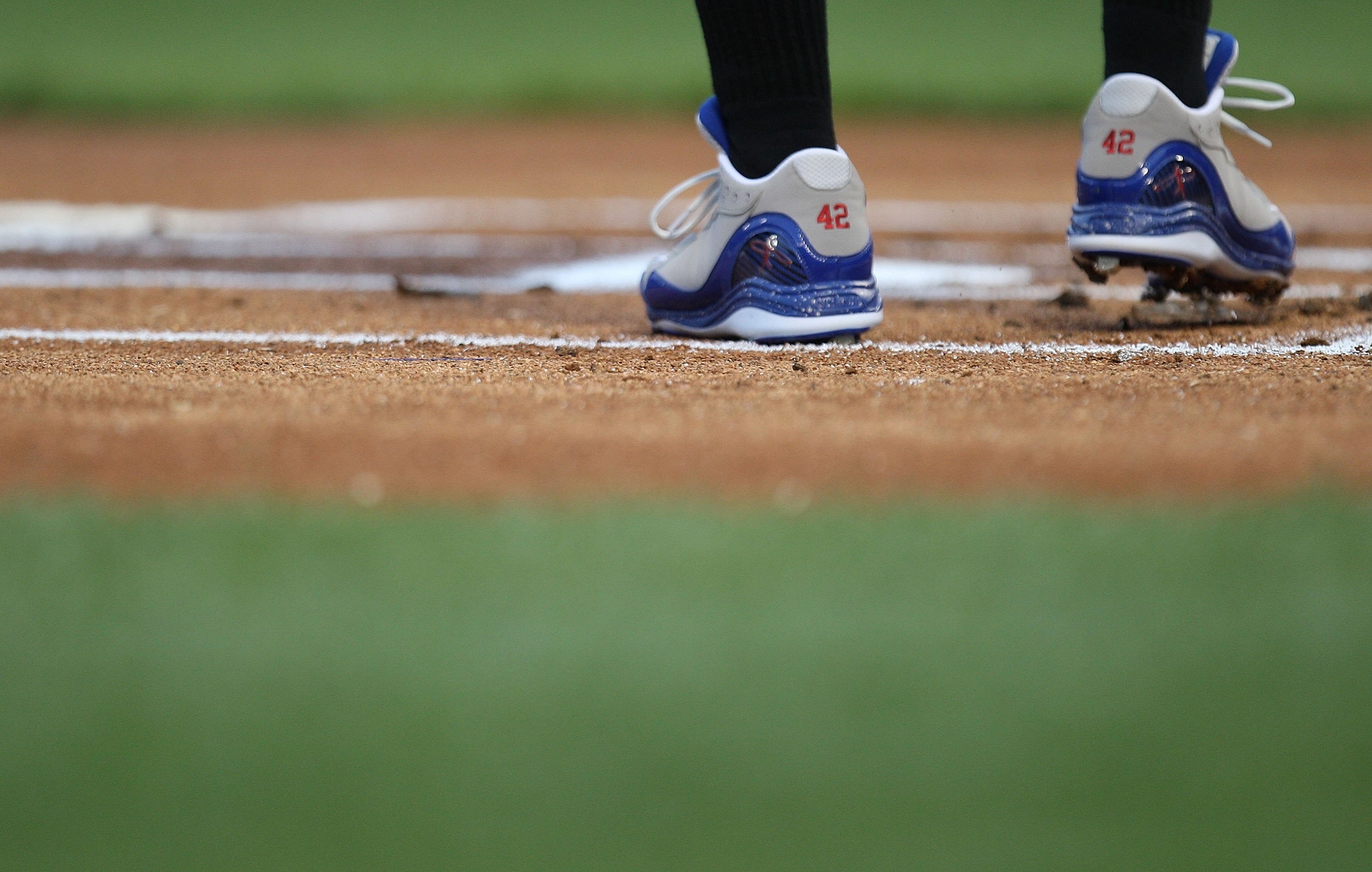 ARLINGTON, TX - APRIL 15:  The shoes of Adam Jones of the Baltimore Orioles with the #42 to commemorate Jackie Robinson day during a game against the Texas Rangers on April 15, 2009 at Rangers Ballpark in Arlington, Texas.  (Photo by Ronald Martinez/Getty