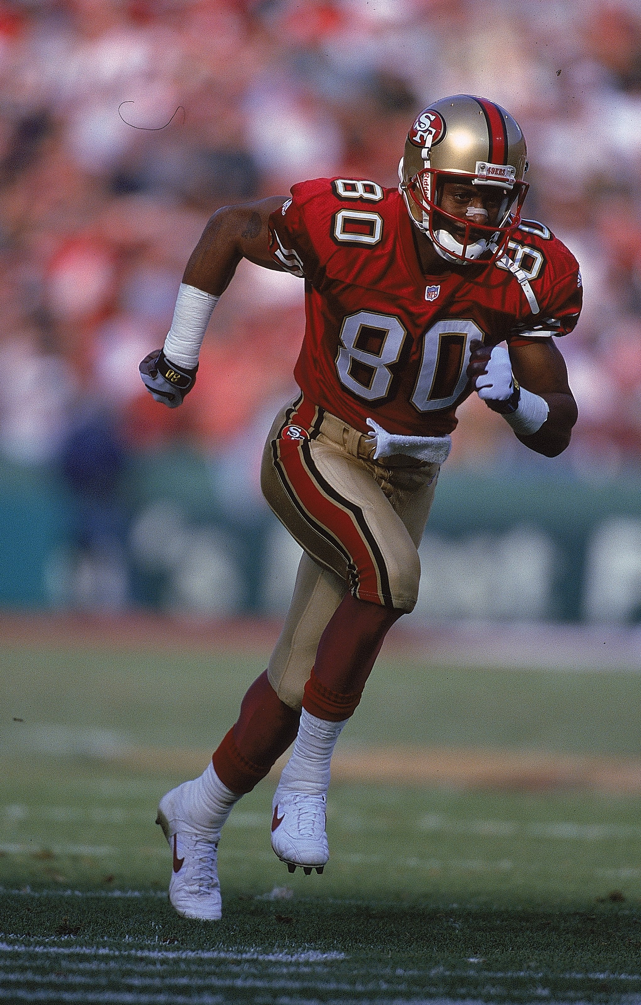12 Dec 1999:  Jerry Rice #80 of the San Francisco 49ers runs on the field during the game against the Atlanta Falcons at 3Comm Park in San Francisco, California. The 49ers defeated the Falcons 26-7. Mandatory Credit: Jed Jacobsohn  /Allsport