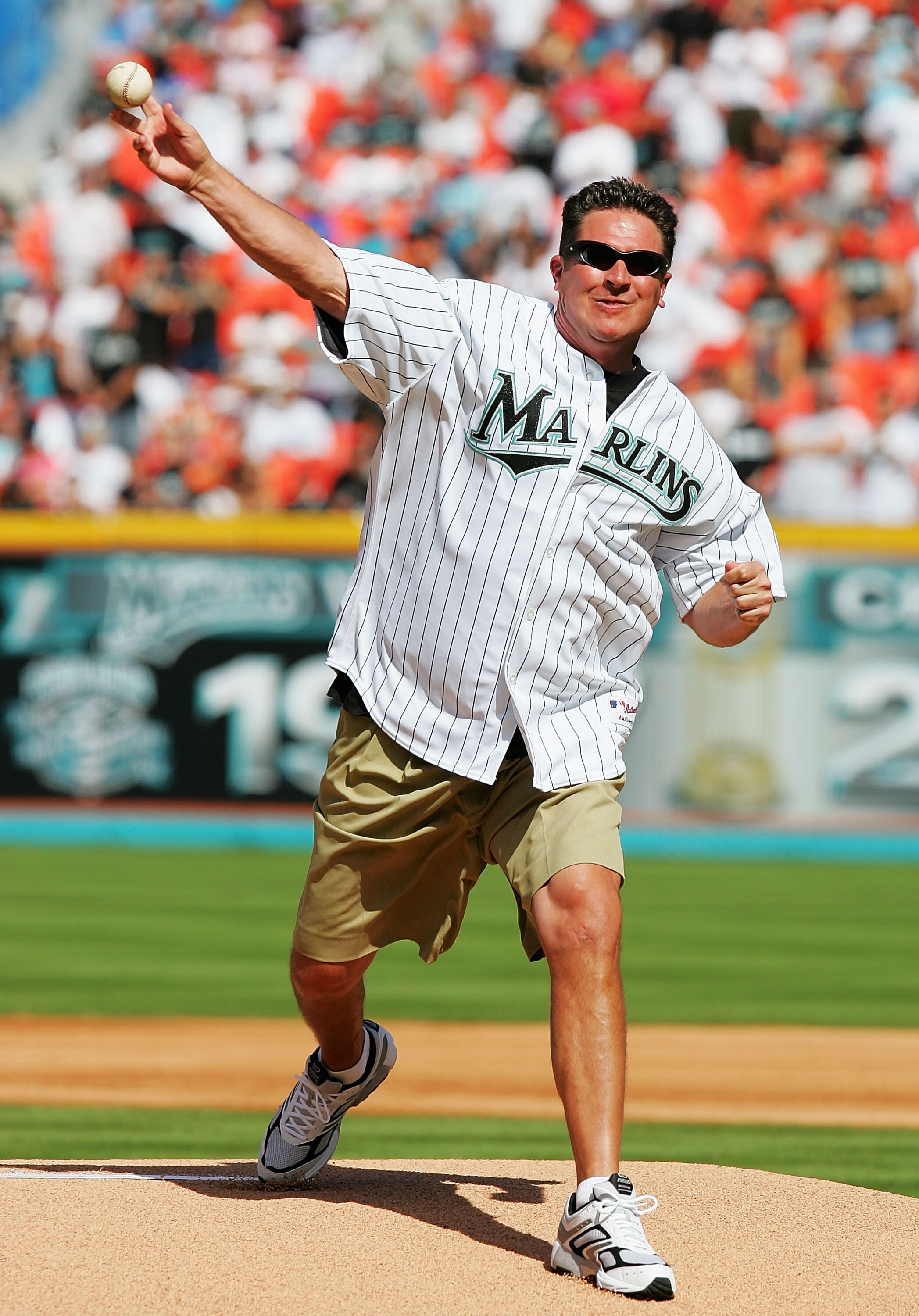 MIAMI - APRIL 5:  Football Hall of Famer Dan Marino throws out the opening pitch before the  Atlanta Braves play the Florida Marlins at Dolphins Stadium on April 5, 2005 in Miami, Florida.  (Photo by Matthew Stockman/Getty Images)