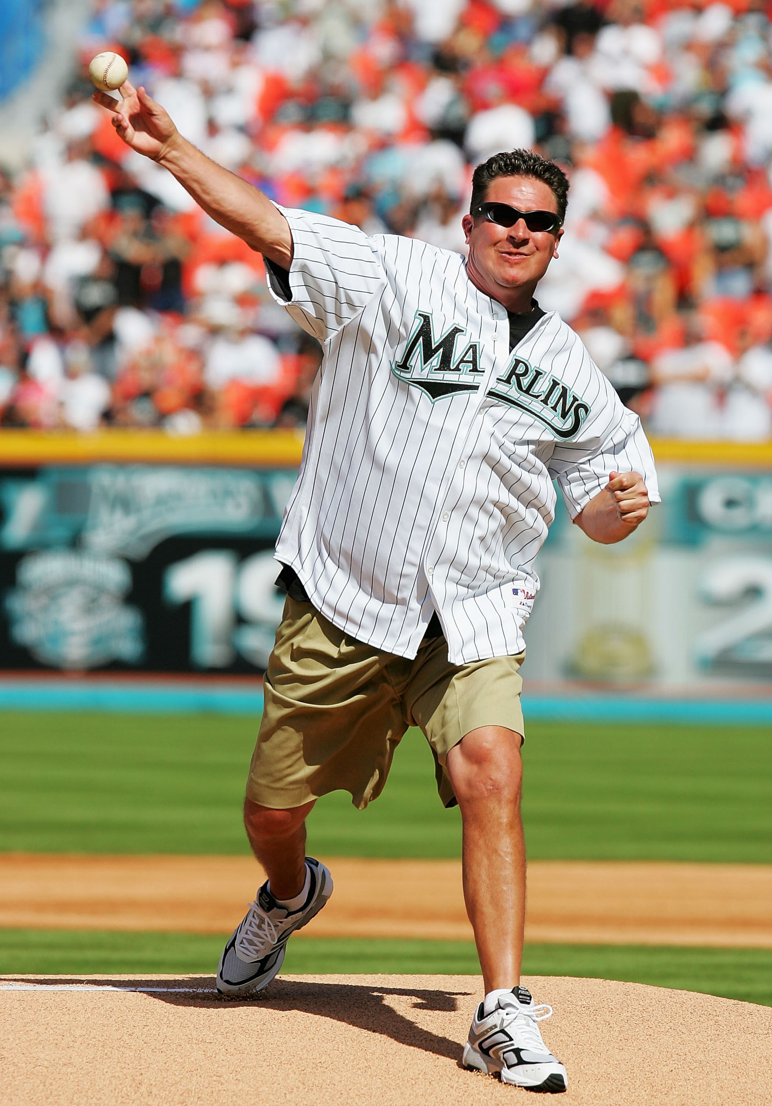 MIAMI - APRIL 5:  Football Hall of Famer Dan Marino throws out the opening pitch before the  Atlanta Braves play the Florida Marlins at Dolphins Stadium on April 5, 2005 in Miami, Florida.  (Photo by Matthew Stockman/Getty Images)