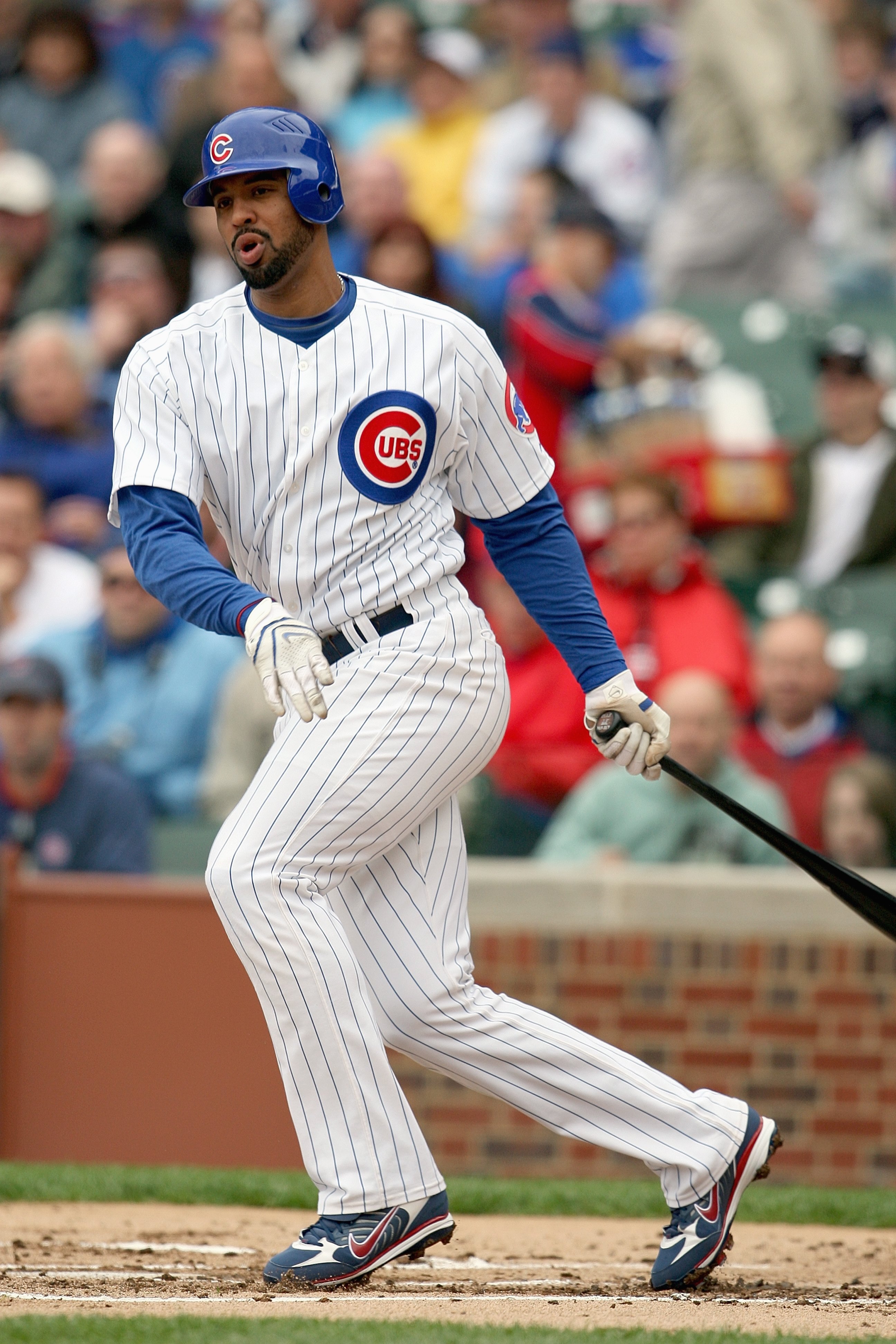 CHICAGO - MAY 09:  Derrek Lee #25 of the Chicago Cubs swings at a pitch during the game against the Arizona Diamondbacks on May 9, 2008 at Wrigley Field in Chicago, Illinois. The Cubs defeated the Diamondbacks 3-1. (Photo by Jonathan Daniel/Getty Images)