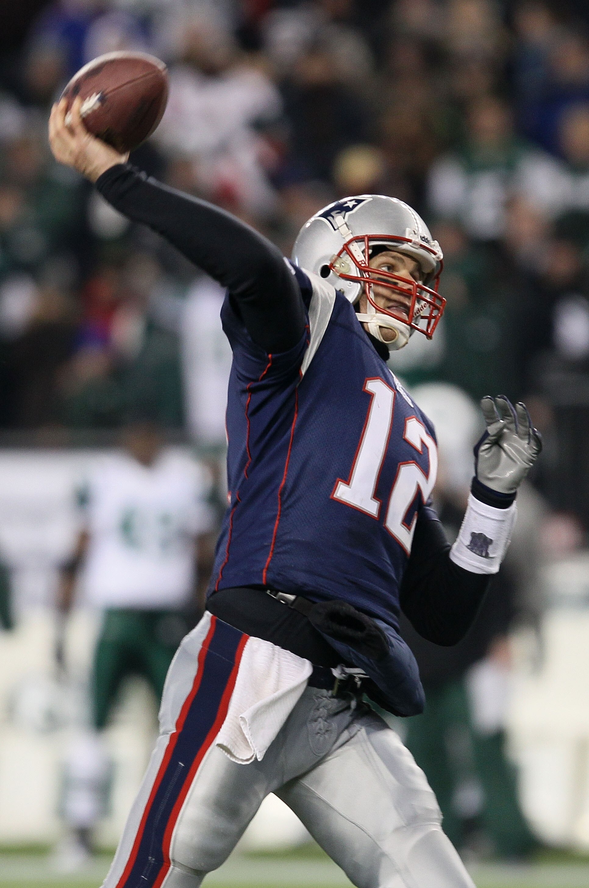 FOXBORO, MA - JANUARY 16:  Quarterback Tom Brady #12 of the New England Patriots throws a pass during their 2011 AFC divisional playoff game against the New York Jets at Gillette Stadium on January 16, 2011 in Foxboro, Massachusetts.  (Photo by Elsa/Getty