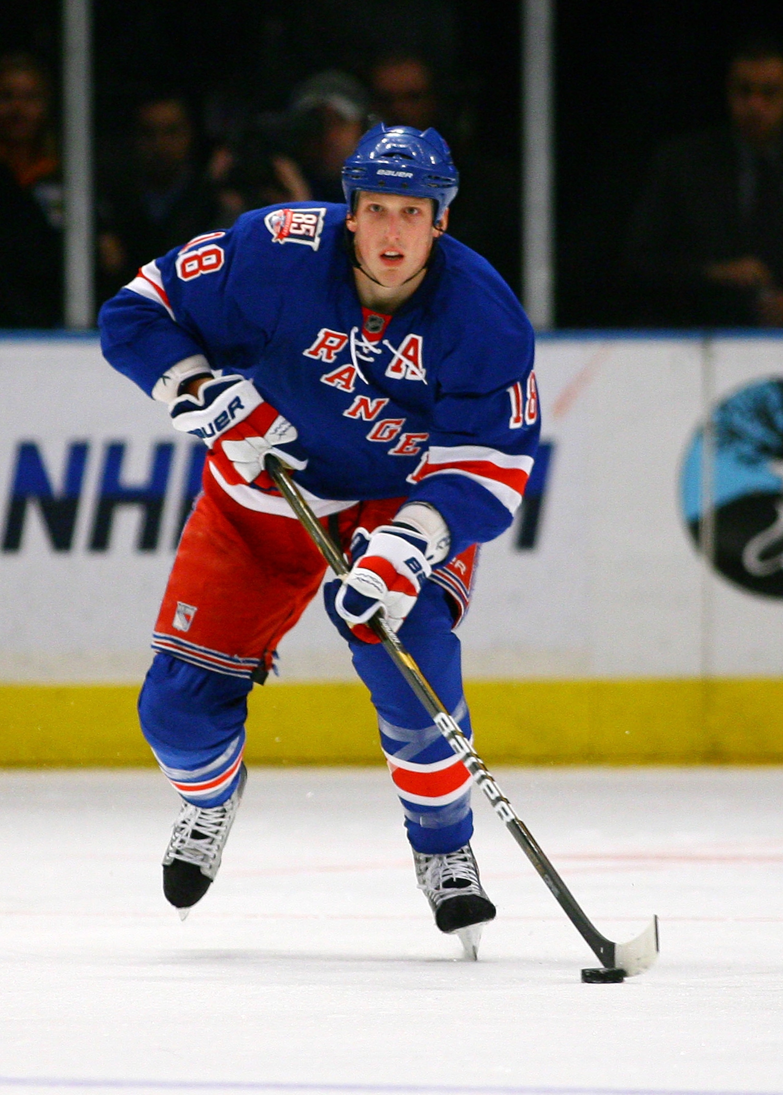 NEW YORK , NY - JANUARY 13: Marc Staal #18 of the New York Rangers plays the puck against the Vancouver Canucks during the game at Madison Square Garden on January 13, 2011 in New York City. (Photo by Andy Marlin/Getty Images)