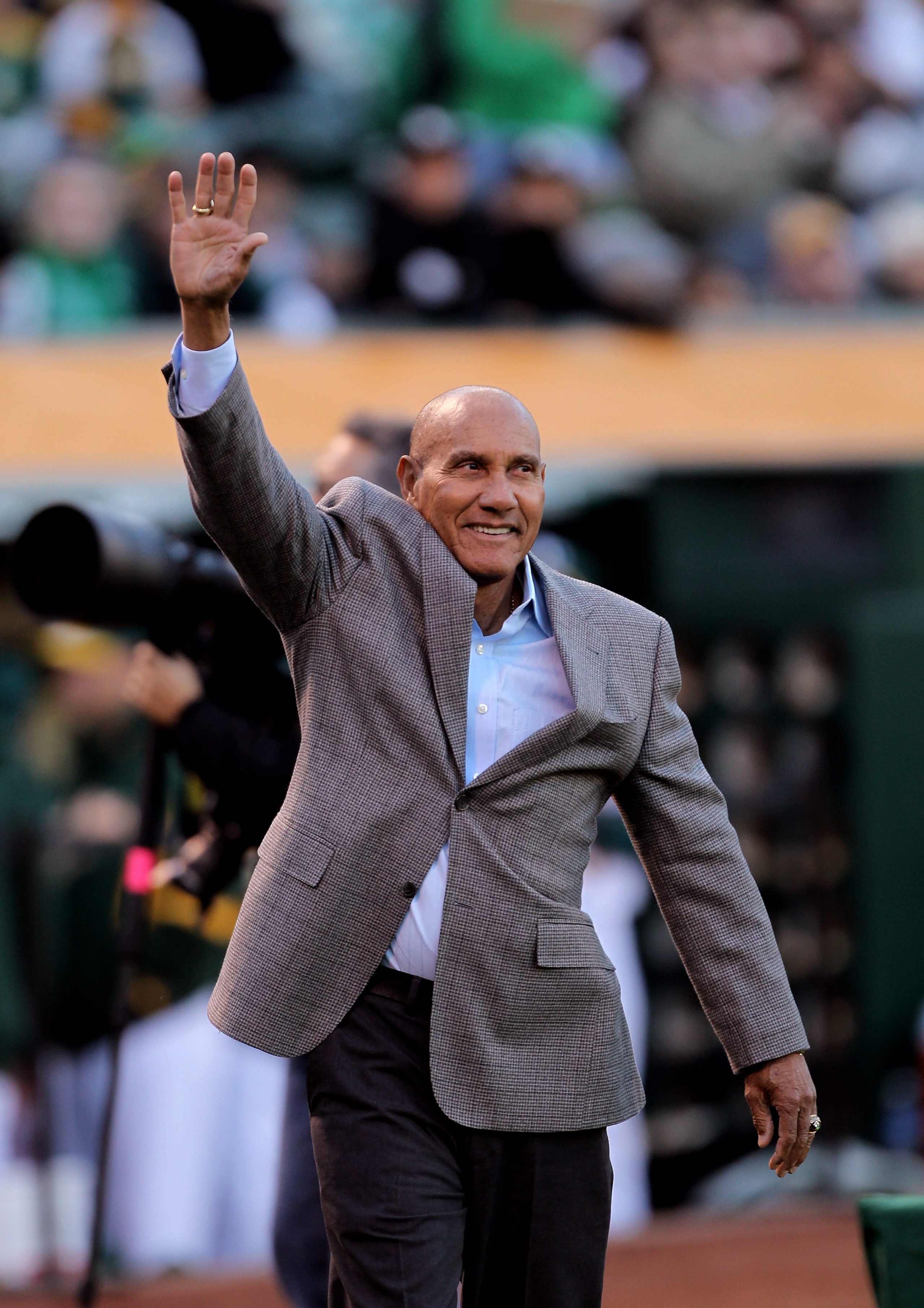 OAKLAND, CA - APRIL 05:  Former Athletics' player Bert Campaneris waves to the crowd before being honored in a ceremony before the game between the Seattle Mariners and the Oakland Athletics on Opening Day at the Oakland-Alameda County Coliseum on April 5