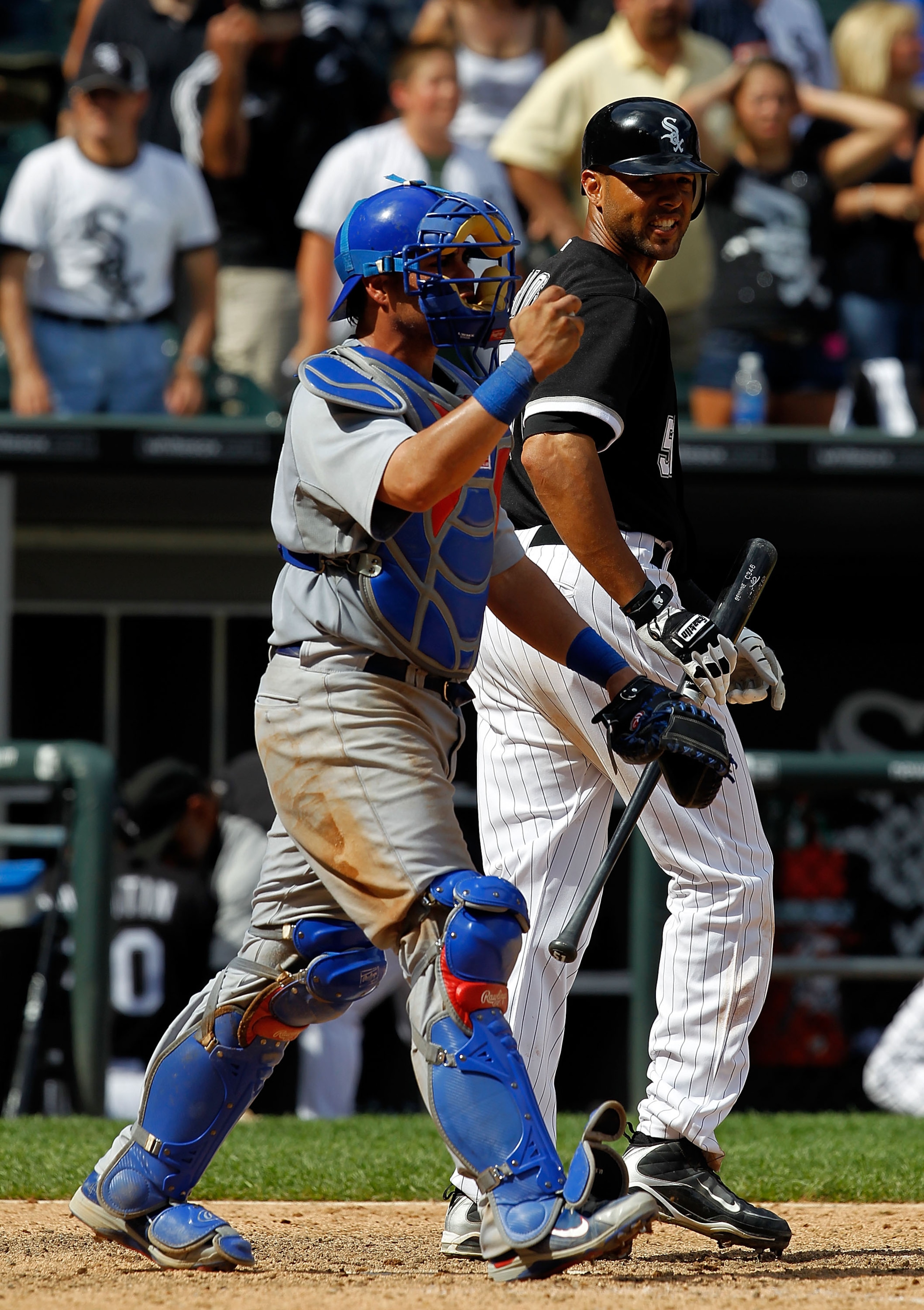 CHICAGO - JUNE 27: Alex Rios #51 of the Chicago White Sox (R) has words for Geovany Soto #18 of the Chicago Cubs after striking out to end the game at U.S. Cellular Field on June 27, 2010 in Chicago, Illinois. The Cubs defeated the White Sox 8-6. (Photo b