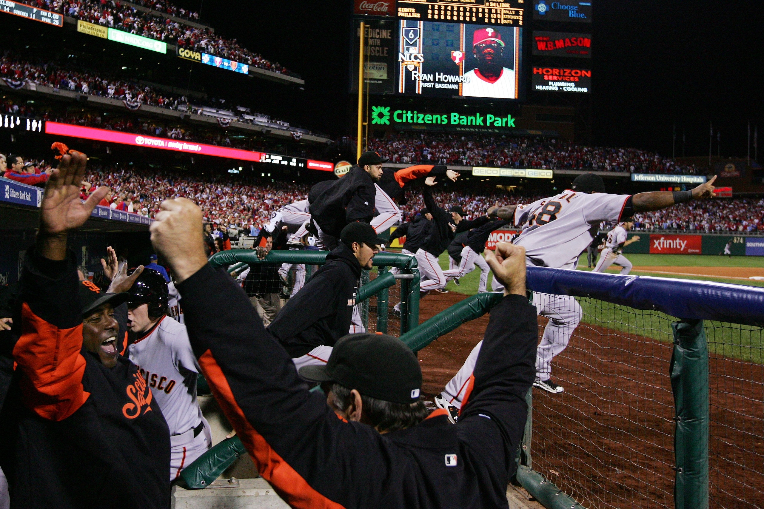 PHILADELPHIA - OCTOBER 23:  The San Francisco Giants celebrate defeating the Philadelphia Phillies 3-2 and winning the pennant in Game Six of the NLCS during the 2010 MLB Playoffs at Citizens Bank Park on October 23, 2010 in Philadelphia, Pennsylvania.  (