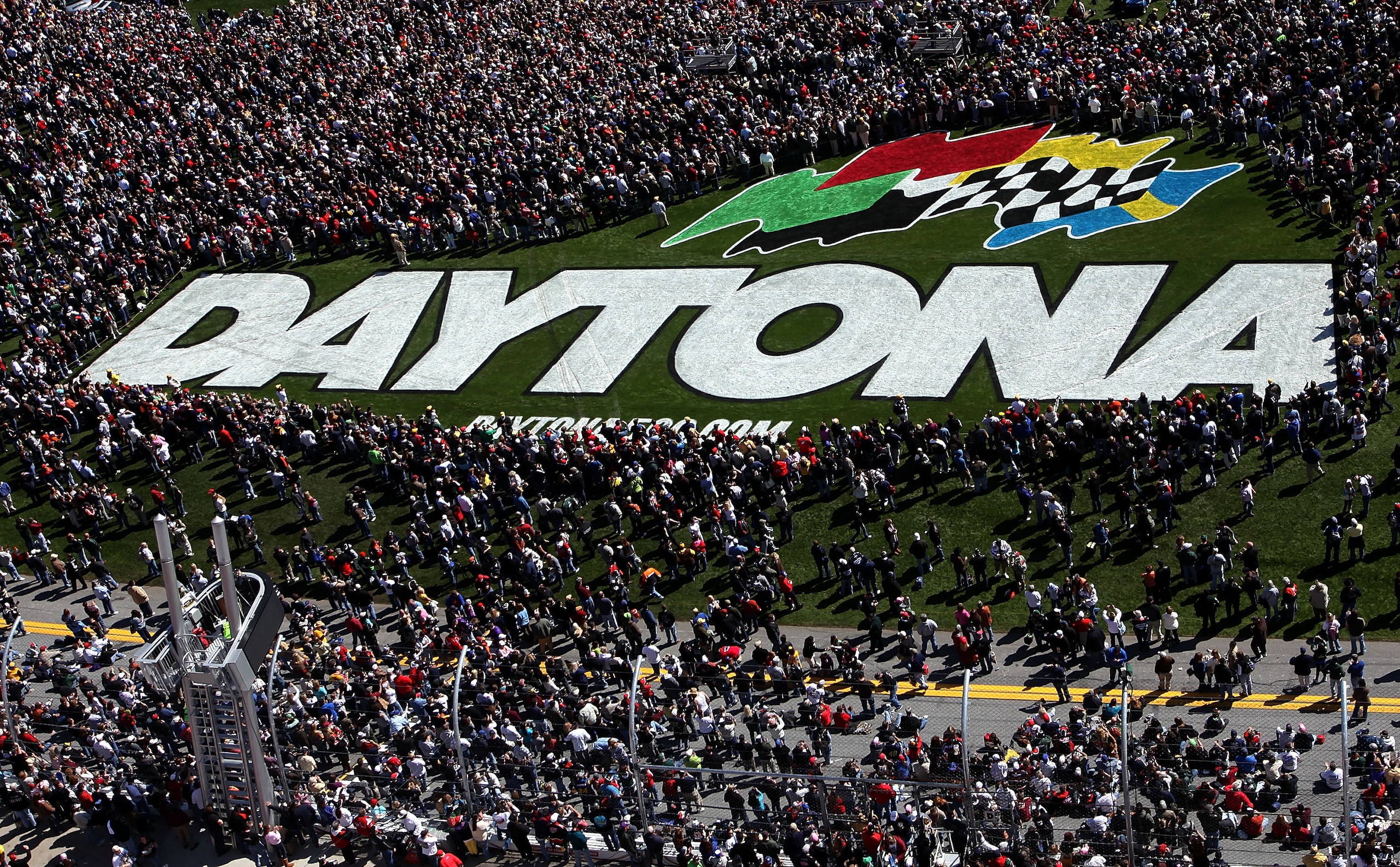 DAYTONA BEACH, FL - FEBRUARY 14: Fans crowd the infield trioval grass during pre-race festivities before the NASCAR Sprint Cup Series Daytona 500 at Daytona International Speedway on February 14, 2010 in Daytona Beach, Florida. (Photo by Jonathan Ferre DAYTONA BEACH, FL - FEBRUARY 14: Fans crowd the infield trioval grass during pre-race festivities before the NASCAR Sprint Cup Series Daytona 500 at Daytona International Speedway on February 14, 2010 in Daytona Beach, Florida. (Photo by Jonathan Ferre