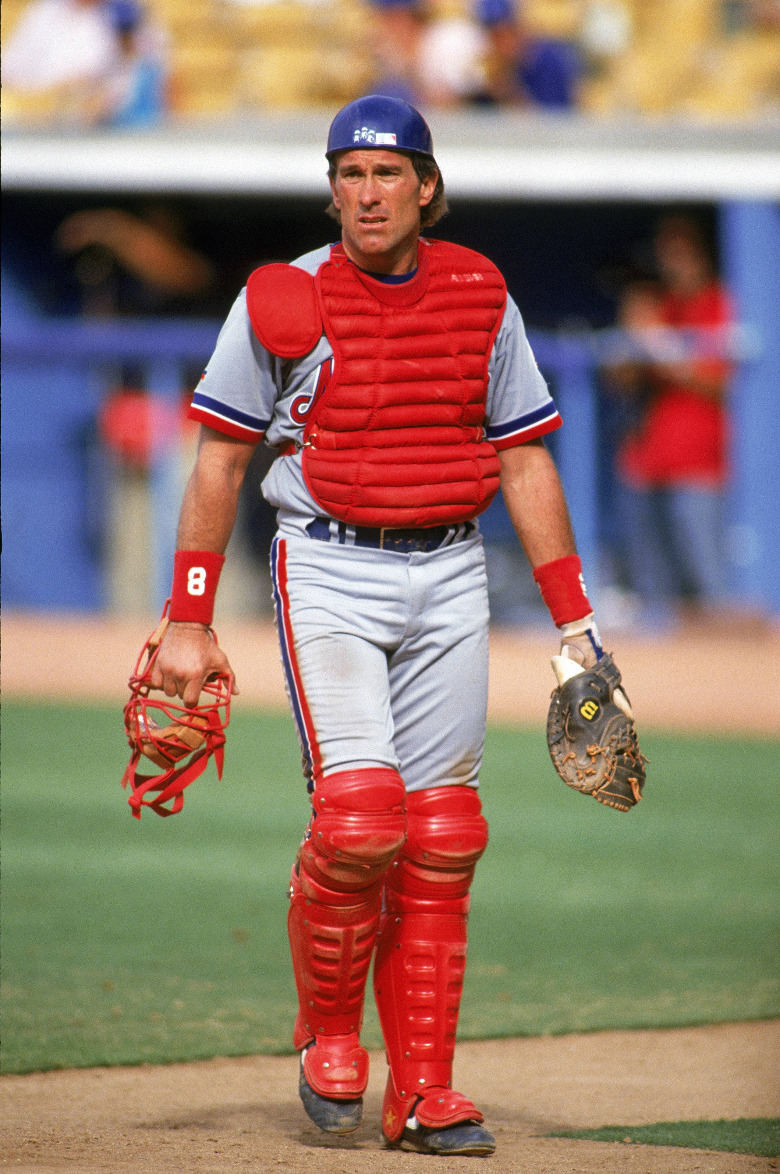 LOS ANGELES - JULY 6:  Catcher Gary Carter #8 of the Montreal Expos walks with his facemask in hand during a game against the Dodgers on July 6, 1992 at Dodger Stadium in Los Angeles, California. (Photo by Ken Levine/Getty Images)