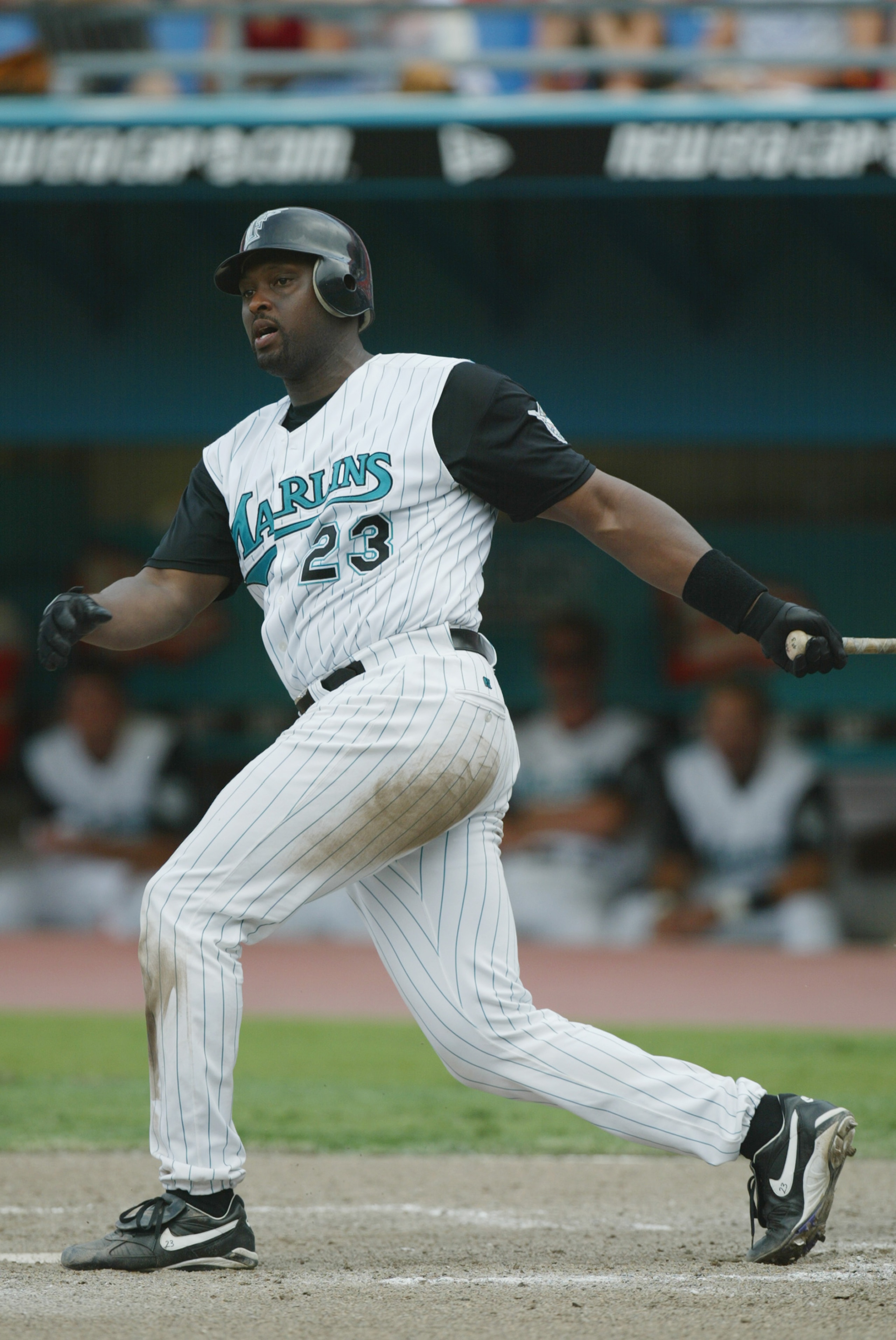 MIAMI - JULY 21:  Catcher Charles Johnson #23 of the Florida Marlins swings the bat during the MLB game against the Montreal Expos on July 21, 2002 at Pro Player Stadium in Miami, Florida.  The Expos won 4-0.  (Photo By Eliot J. Schechter/Getty Images)