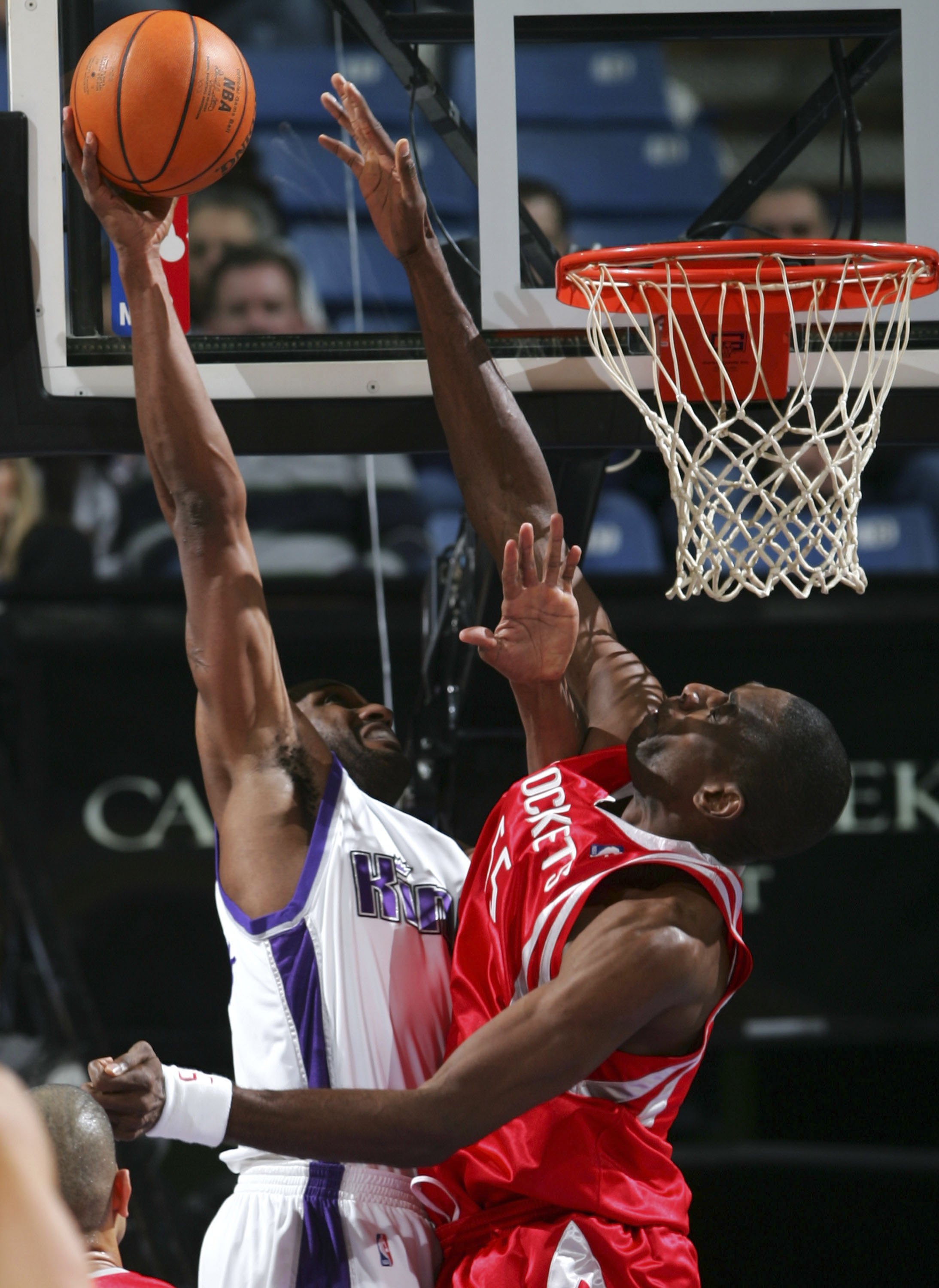 SACRAMENTO, CA - JANUARY 13:  Dikembe Mutombo #55 of the Houston Rockets tries to block a shot from Shareef Abdur-Rahim #3 of the Sacramento Kings during an NBA game at Arco Arena January 13, 2007 in Sacramento, California.  NOTE TO USER: User expressly a
