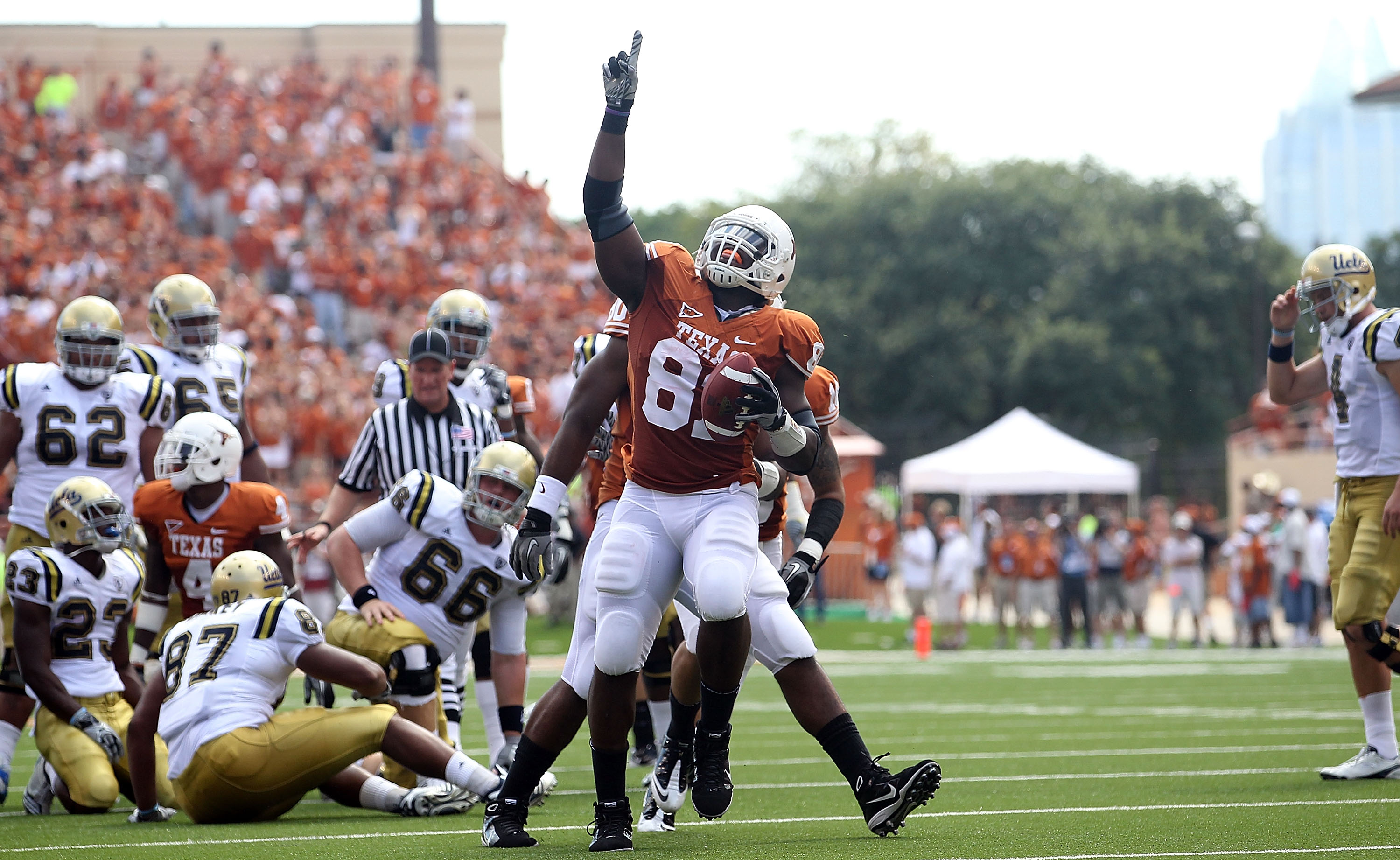AUSTIN, TX - SEPTEMBER 25:  Defensive end Sam Acho #81 of the Texas Longhorns reacts after making a fumble recovery against the UCLA Bruins at Darrell K Royal-Texas Memorial Stadium on September 25, 2010 in Austin, Texas.  (Photo by Ronald Martinez/Getty