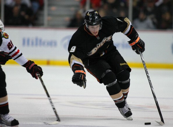 ANAHEIM, CA - JANUARY 02:  Bobby Ryan #9 of the Anaheim Ducks protects the puck from a poke check as he plays the puck through the neutral zone against the Chicago Blackhawks during the NHL game at Honda Center on January 2, 2011 in Anaheim, California. T