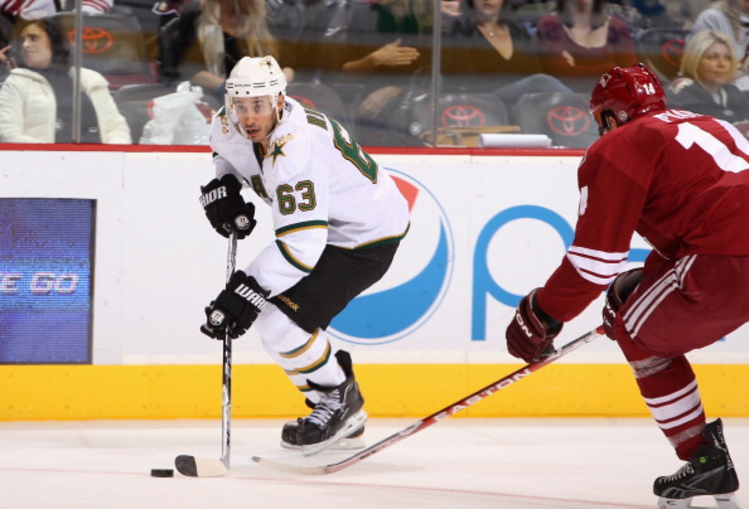GLENDALE, AZ - DECEMBER 11:  Mike Ribeiro #63 of the Dallas Stars skates with the puck during the NHL game against the Phoenix Coyotes at Jobing.com Arena on December 11, 2010 in Glendale, Arizona.  (Photo by Christian Petersen/Getty Images)