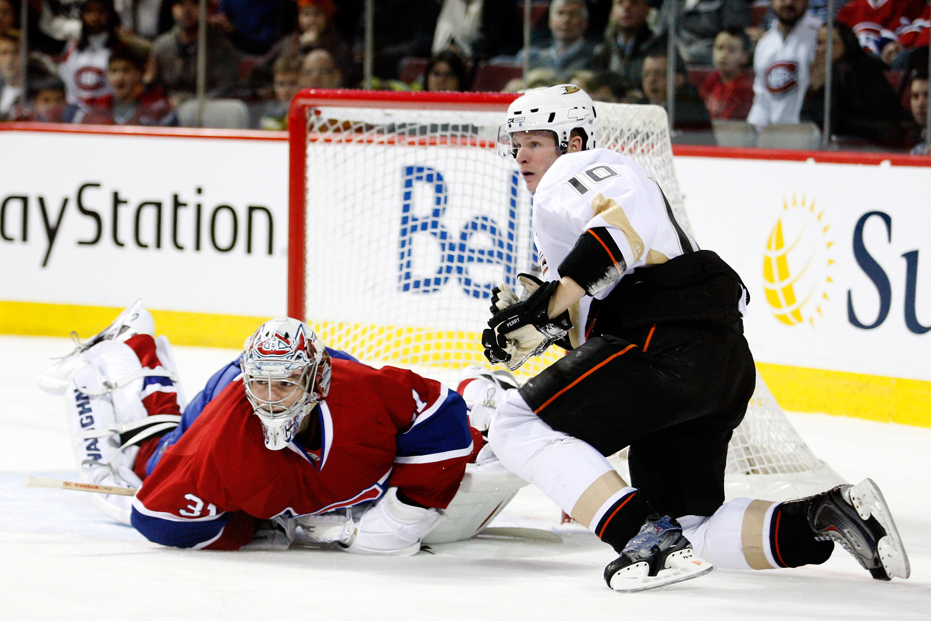MONTREAL, CANADA - JANUARY 22:  Corey Perry #10 of the Anaheim Ducks collides with Carey Price #31 of the Montreal Canadiens during the NHL game at the Bell Centre on January 22, 2011 in Montreal, Quebec, Canada.  The Ducks defeated the Canadiens 4-3 in a
