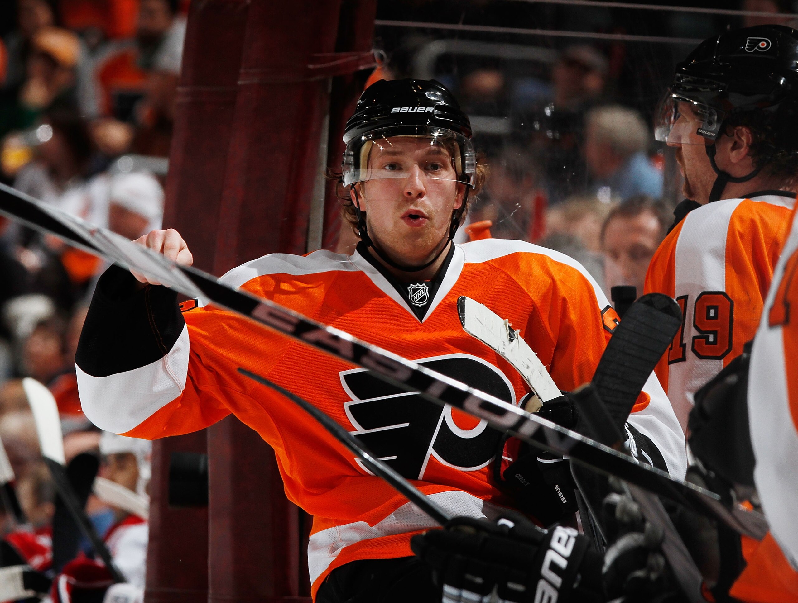 PHILADELPHIA, PA - JANUARY 25:  Claude Giroux #28 of the Philadelphia Flyers talks to teammates on the bench during an NHL hockey game against the Montreal Canadiens at the Wells Fargo Center on January 25, 2011 in Philadelphia, Pennsylvania.  (Photo by P
