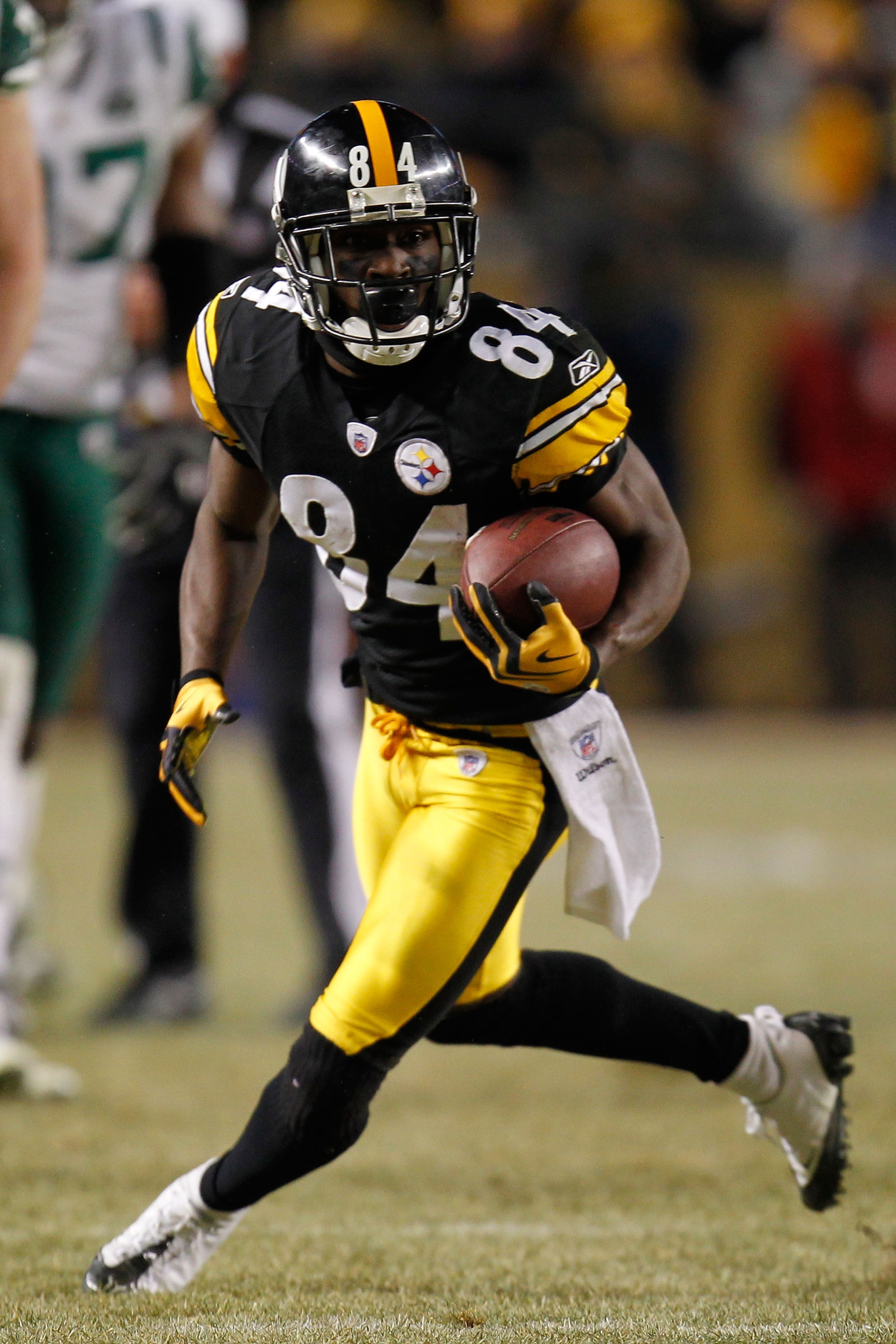 PITTSBURGH, PA - JANUARY 23:  Antonio Brown #84 of the Pittsburgh Steelers runs down field against the New York Jets during the 2011 AFC Championship game at Heinz Field on January 23, 2011 in Pittsburgh, Pennsylvania. The Steelers defeated the Jets 24 to