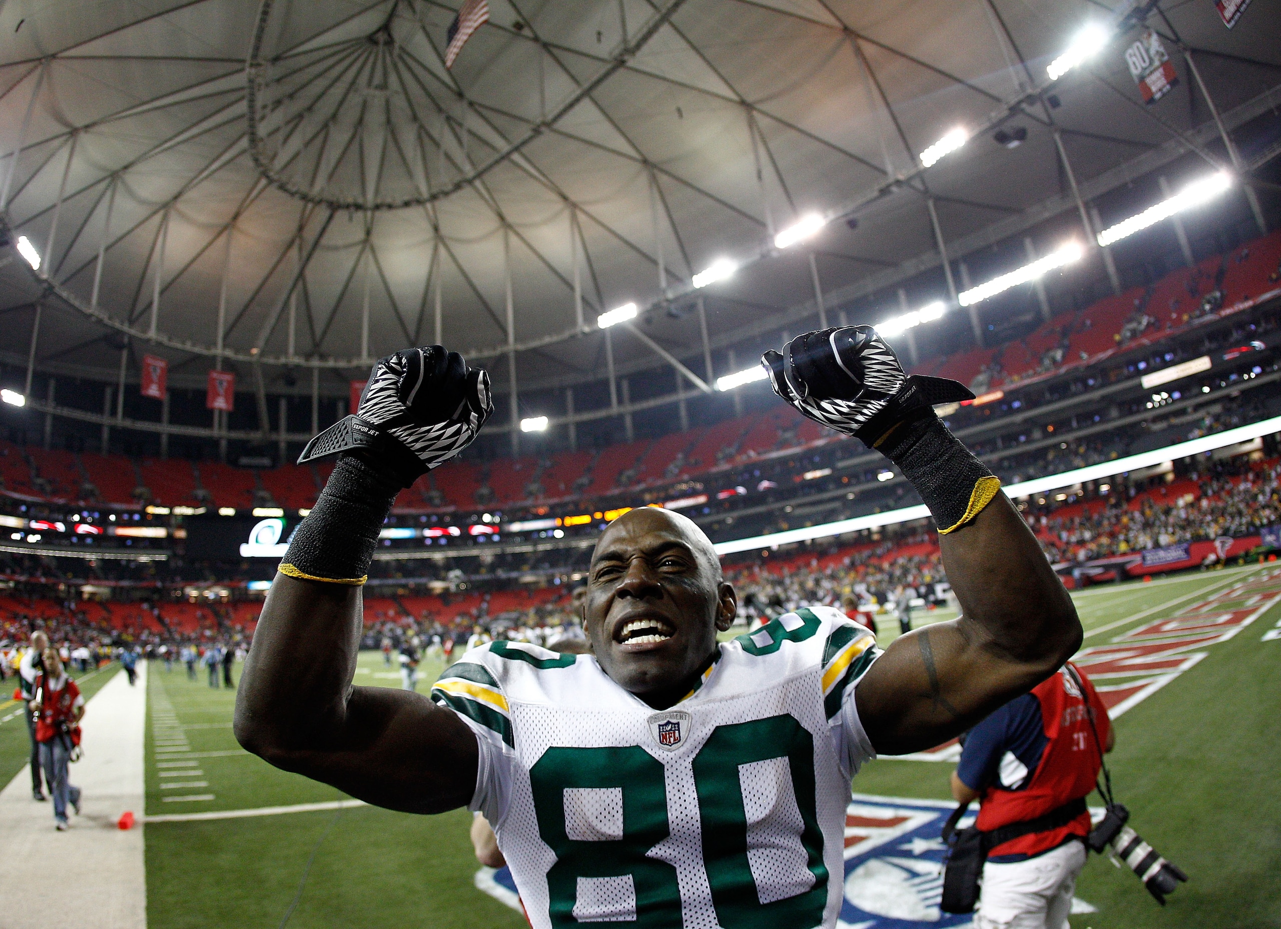 ATLANTA, GA - JANUARY 15:  Donald Driver #80 of the Green Bay Packers celebrates as he walks off the field after the Packers own 48-21 against the Atlanta Falcons during their 2011 NFC divisional playoff game at Georgia Dome on January 15, 2011 in Atlanta