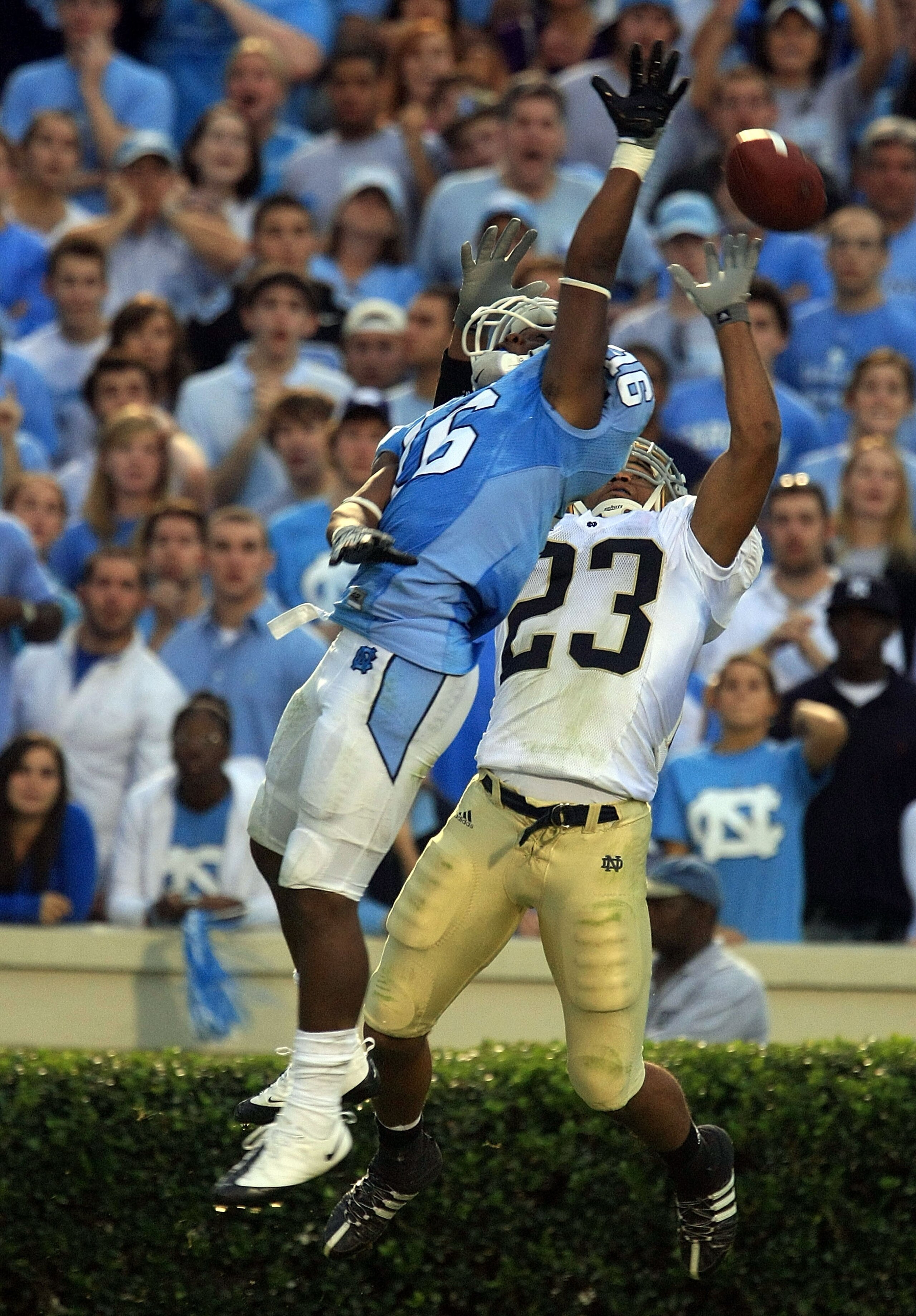 CHAPEL HILL, NC - OCTOBER 11:  Kendric Burney #16 of the North Carolina Tar Heels stops a pass in front of Golden Tate, #23 of the Notre Dame Fighting Irish during their game at Kenan Stadiium on October 11, 2008 in Chapel Hill, North Carolina. (Photo by