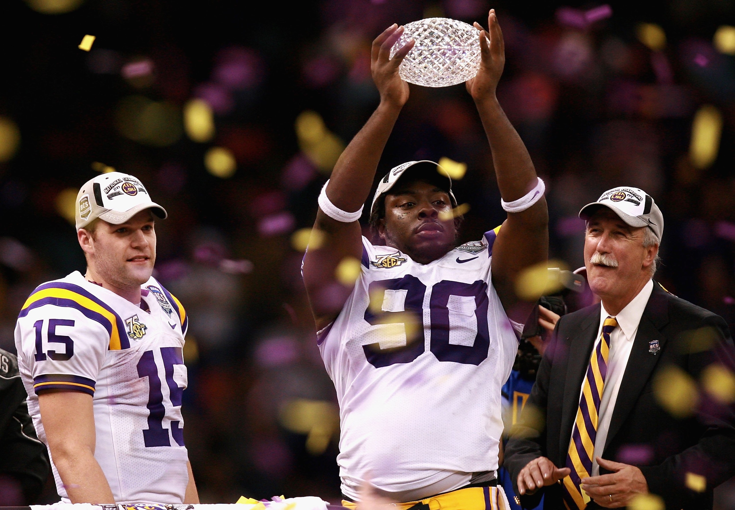 NEW ORLEANS - JANUARY 07: Ricky Jean-Francois #90 of the Louisiana State University Tigers celebrates with the championship trophy after defeating the Ohio State Buckeyes 38-24 in the AllState BCS National Championship on January 7, 2008 at the Louisiana NEW ORLEANS - JANUARY 07: Ricky Jean-Francois #90 of the Louisiana State University Tigers celebrates with the championship trophy after defeating the Ohio State Buckeyes 38-24 in the AllState BCS National Championship on January 7, 2008 at the Louisiana