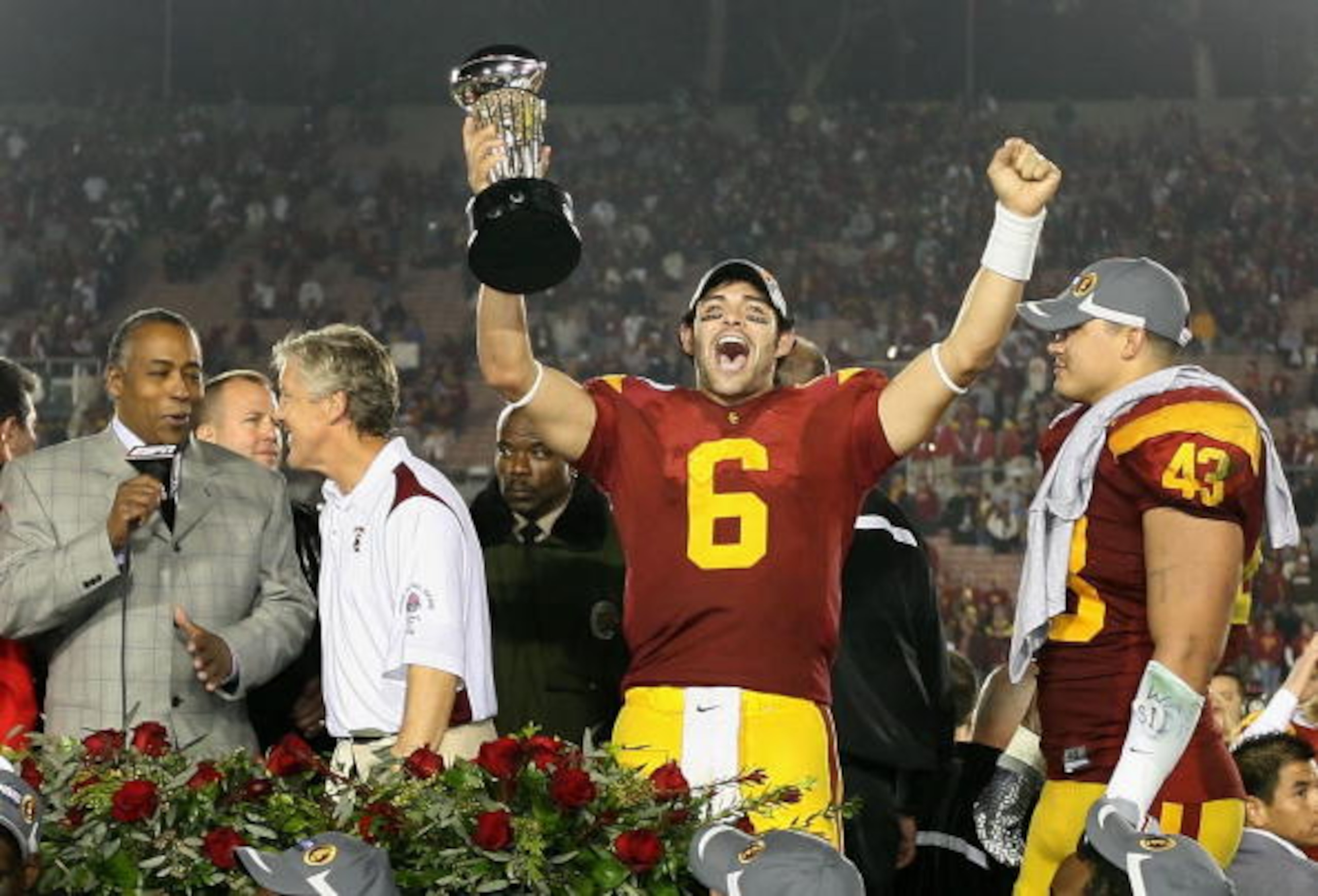 PASADENA, CA - JANUARY 01: Quarterback Mark Sanchez #6 of the USC Trojans celebrates with the 95th Rose Bowl Game trophy after defeating the Penn State Nittany Lions at the Rose Bowl on January 1, 2009 in Pasadena, California. The Trojans defeated the Ni PASADENA, CA - JANUARY 01: Quarterback Mark Sanchez #6 of the USC Trojans celebrates with the 95th Rose Bowl Game trophy after defeating the Penn State Nittany Lions at the Rose Bowl on January 1, 2009 in Pasadena, California. The Trojans defeated the Ni