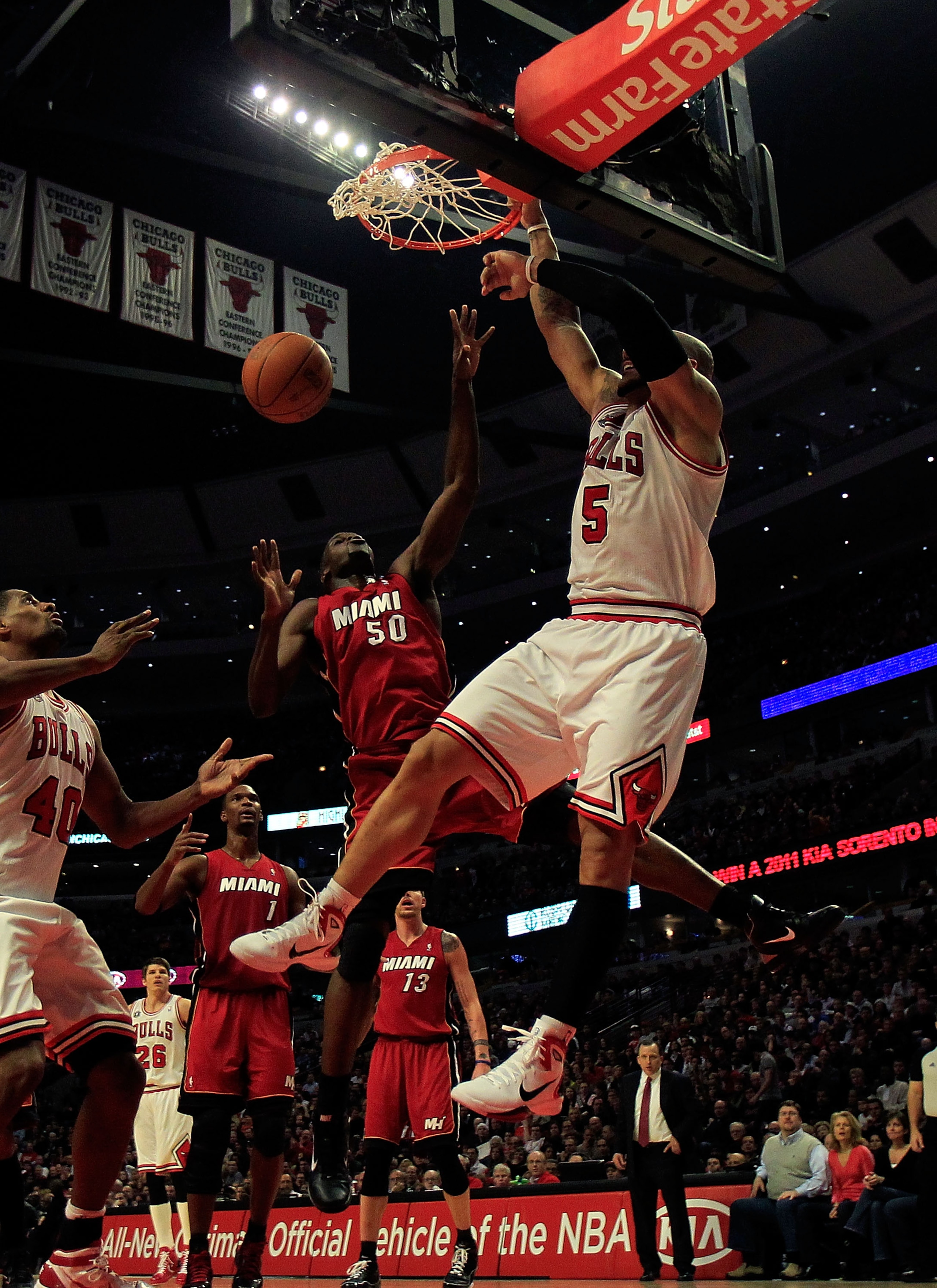 CHICAGO, IL - JANUARY 15: Carlos Boozer #5 of the Chicago Bulls dunks the ball over Joel Anthony #50 of the Miami Heat at the United Center on December 28, 2011 in Chicago, Illinois. The Bulls defeated the Heat 99-96. NOTE TO USER: User expressly acknowle