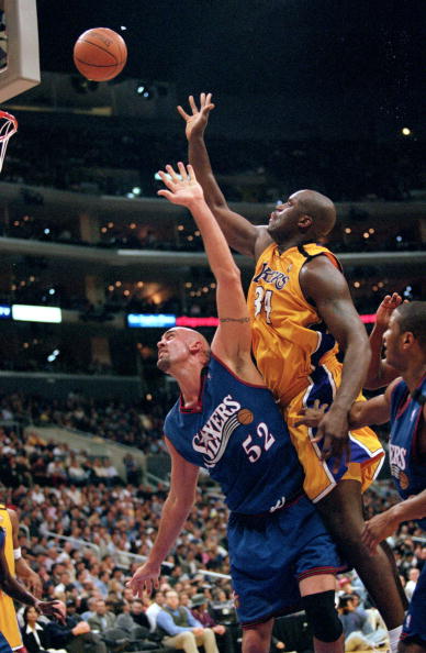 31 Mar 2000:  Matt Geiger #52 of the Philadelphia 76ers jumps to block a shot from Shaquille O''Neal of the Los Angeles Lakers during the game against the Los Angeles Lakers at the Staples Center in Los Angeles, California. The Lakers defeated the 76ers 1