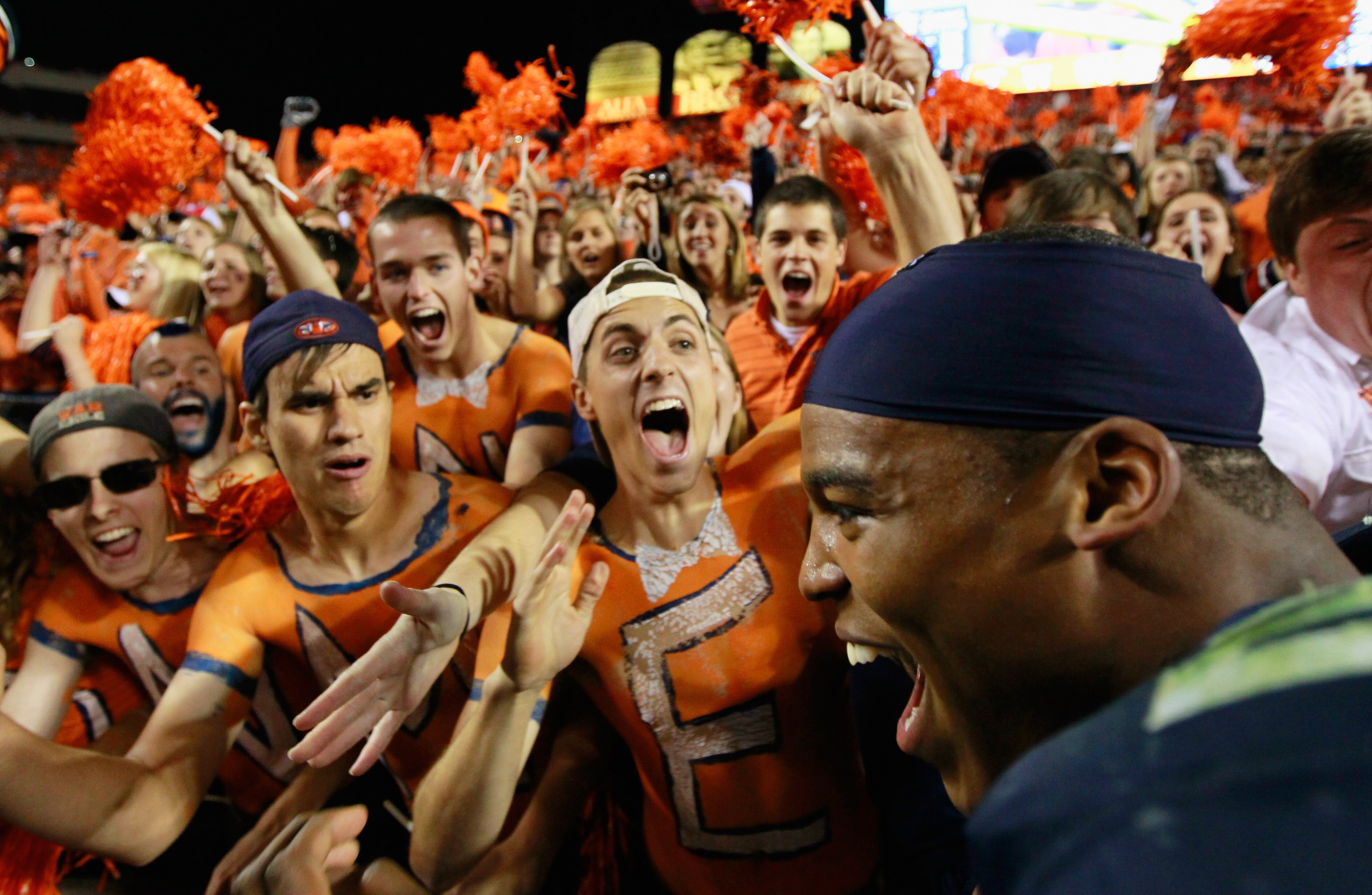 AUBURN, AL - NOVEMBER 13:  Quarterback Cameron Newton #2 of the Auburn Tigers celebrates with fans after their 49-31 win over the Georgia Bulldogs at Jordan-Hare Stadium on November 13, 2010 in Auburn, Alabama.  (Photo by Kevin C. Cox/Getty Images)