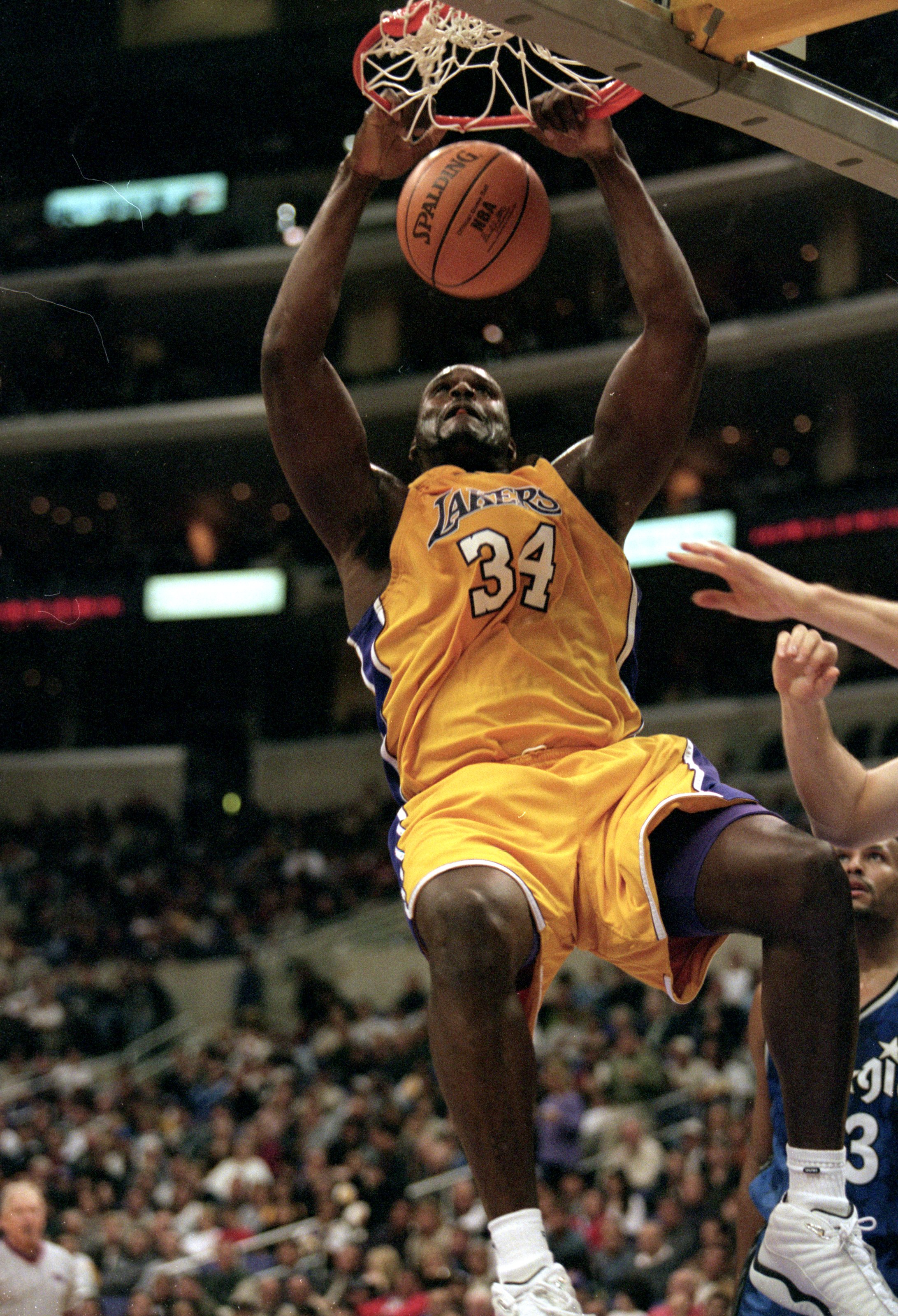 5 Dec 1999: Shaquille O''Neal #34 of the Los Angeles Lakers makes a slam dunk during the game against the Orlando Magic at the Staples Center in Los Angeles, California. The Lakers defeated the Magic 117-100.  Mandatory Credit: Kellie Landis  /Allsport