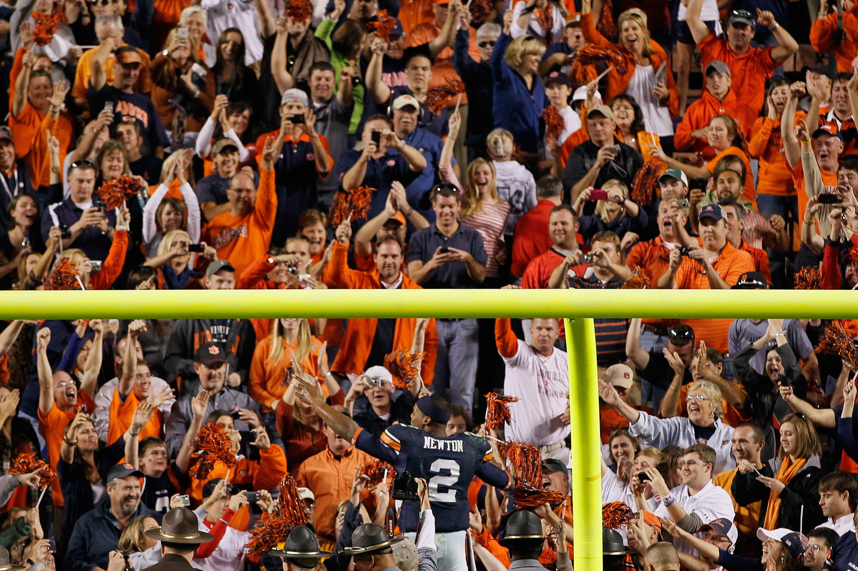 AUBURN, AL - NOVEMBER 13:  Quarterback Cameron Newton #2 of the Auburn Tigers celebrates with fans after their 49-31 win over the Georgia Bulldogs at Jordan-Hare Stadium on November 13, 2010 in Auburn, Alabama.  (Photo by Kevin C. Cox/Getty Images)
