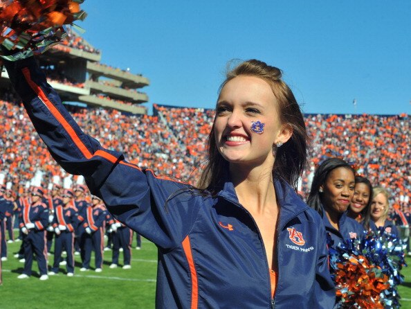 AUBURN, AL - NOVEMBER 06:  A cheerleader of the Auburn Tigers waives to fans  during play against the Chattanooga Mocs November 6, 2010 at Jordan-Hare Stadium in Auburn, Alabama.  (Photo by Al Messerschmidt/Getty Images)