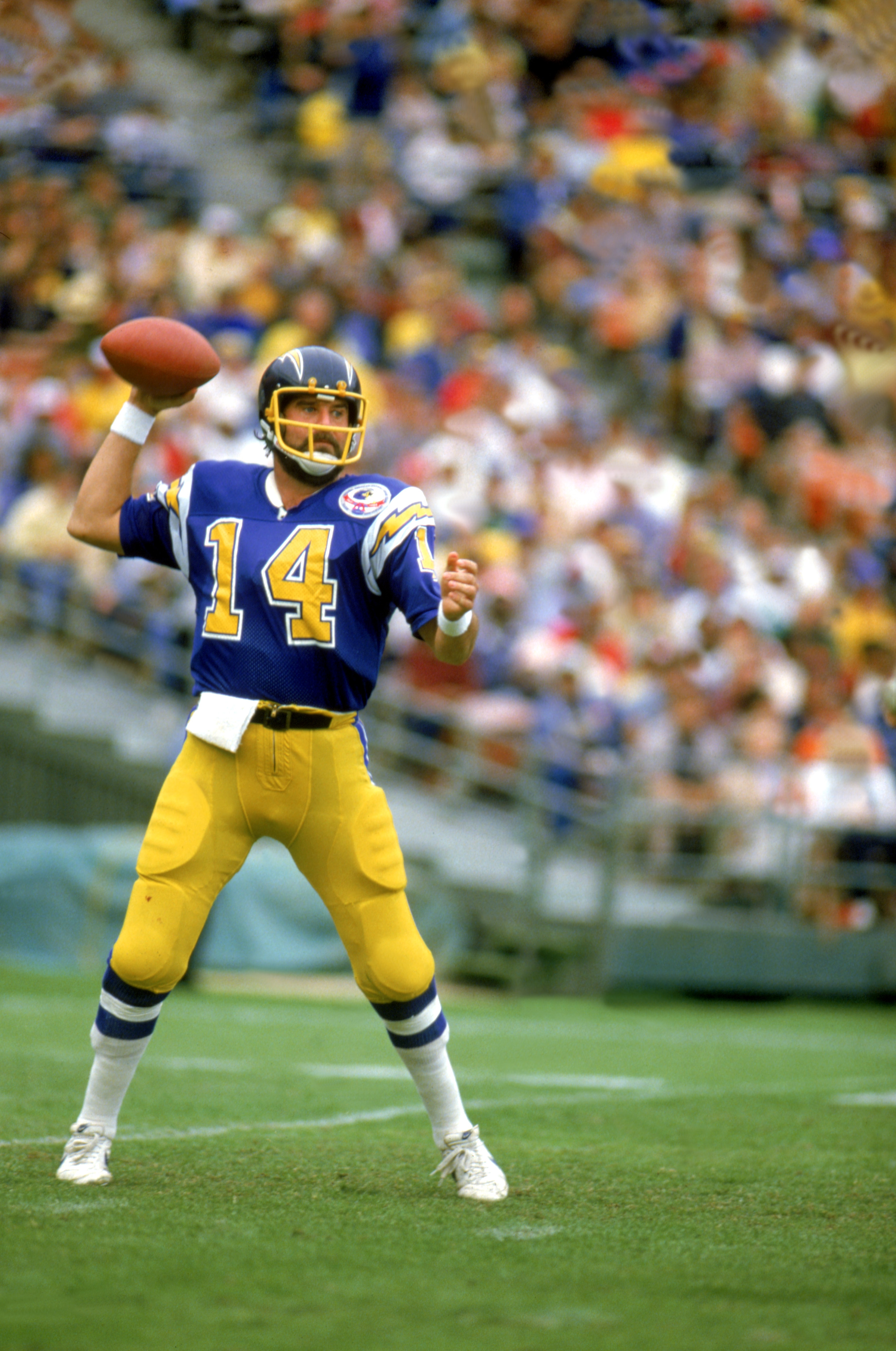 Dan Fouts of the San Diego Chargers drops back to pass against the