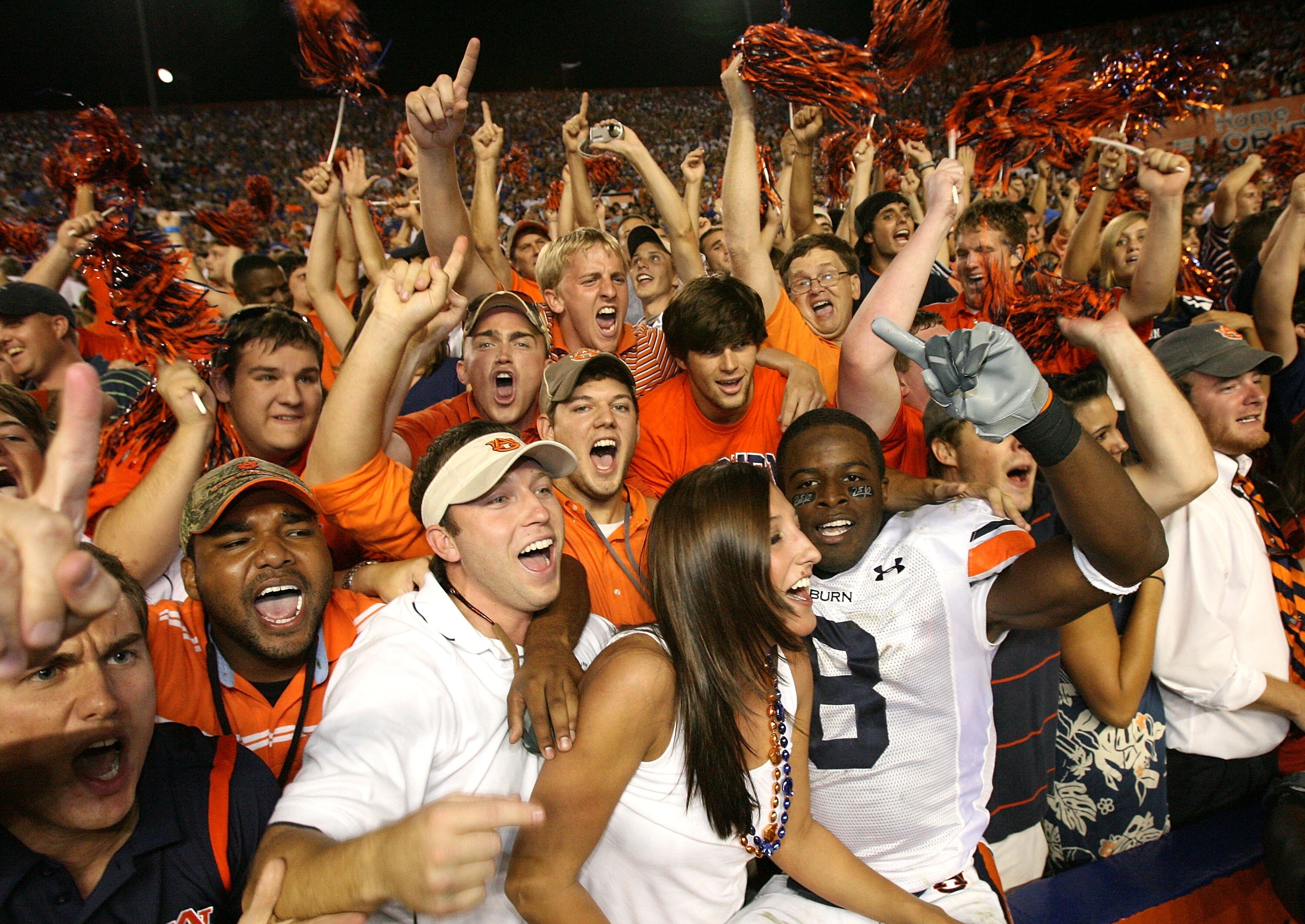 GAINESVILLE, FL - SEPTEMBER 29:  Jerraud Powers #8 of the Auburn Tigers jumps into the stands and celebrates with fans after defeating the Florida Gators at Ben Hill Griffin Stadium September 29, 2007 in Gainesville, Florida.  (Photo by Doug Benc/Getty Im