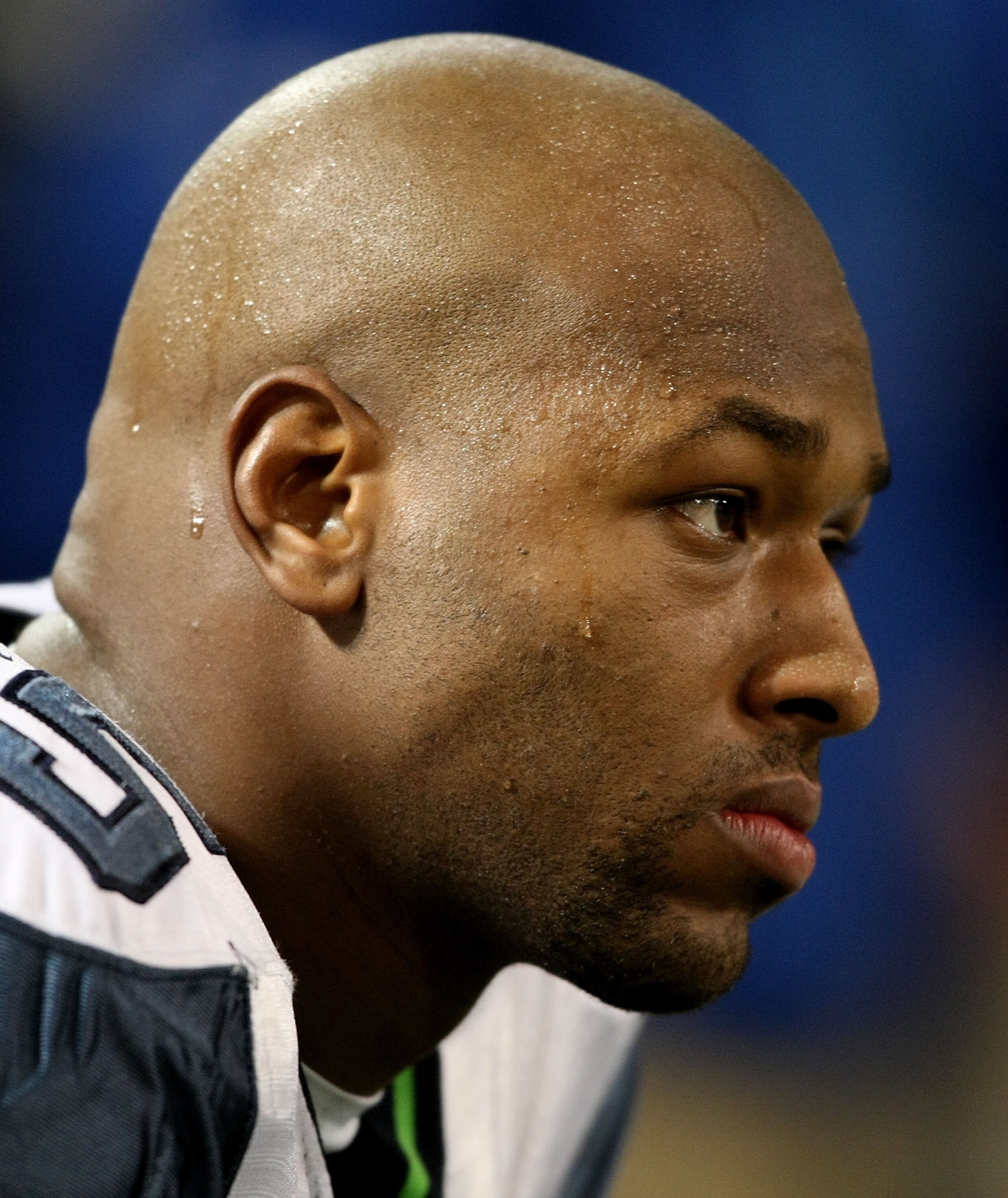 MINNEAPOLIS - NOVEMBER 22:  Lawrence Jackson #95 of the Seattle Seahawks sits on the bench against the Minnesota Vikings at Hubert H. Humphrey Metrodome on November 22, 2009 in Minneapolis, Minnesota.  (Photo by Nick Laham/Getty Images)