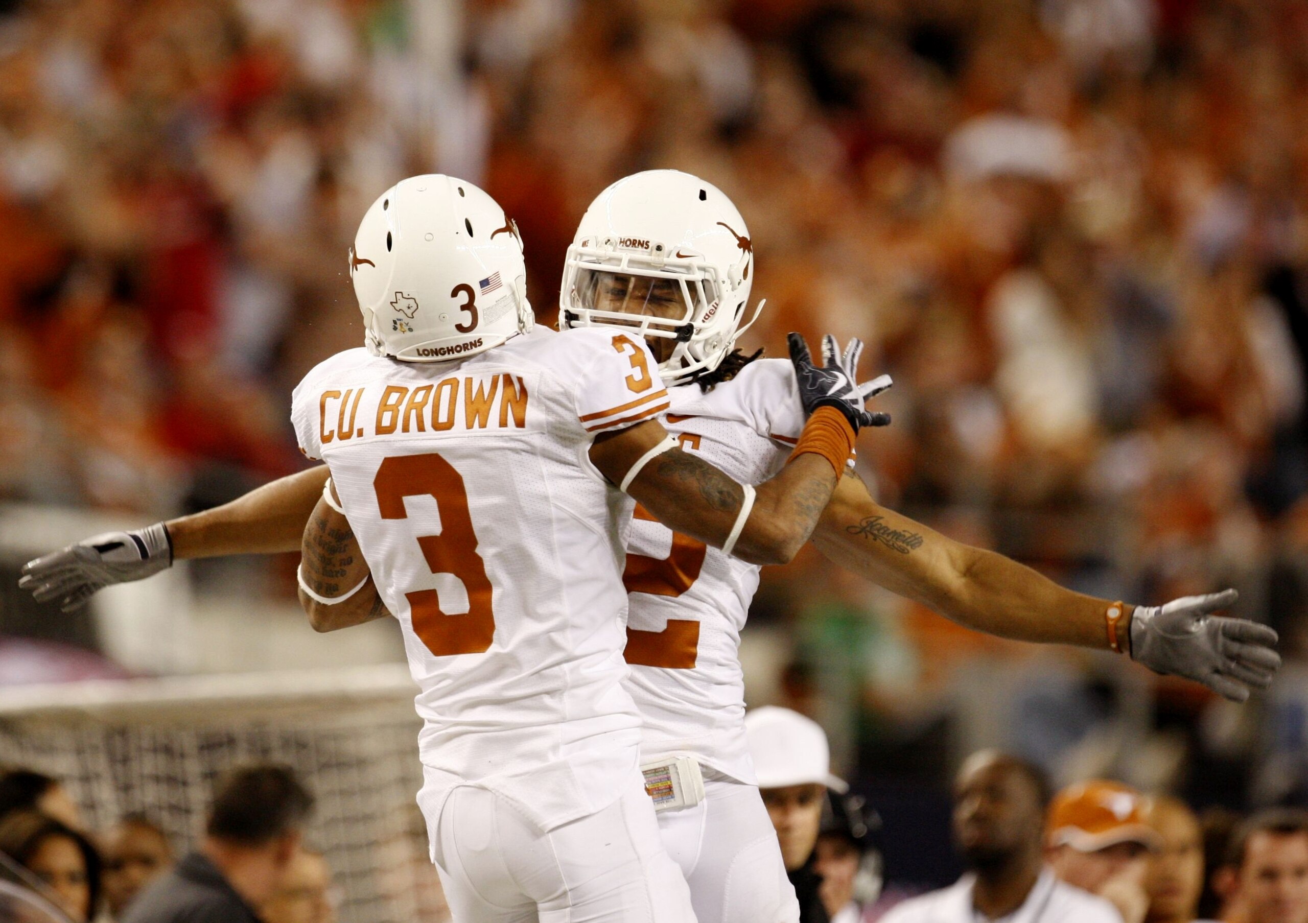 ARLINGTON, TX - DECEMBER 5: Curtis Brown #3 and Earl Thomas #12 of the Texas Longhorns celebrate breaking up a pass against the Nebraska Cornhuskers in the third quarter at Cowboys Stadium on December 5, 2009 in Arlington, Texas. (Photo by Ronald Martin ARLINGTON, TX - DECEMBER 5: Curtis Brown #3 and Earl Thomas #12 of the Texas Longhorns celebrate breaking up a pass against the Nebraska Cornhuskers in the third quarter at Cowboys Stadium on December 5, 2009 in Arlington, Texas. (Photo by Ronald Martin
