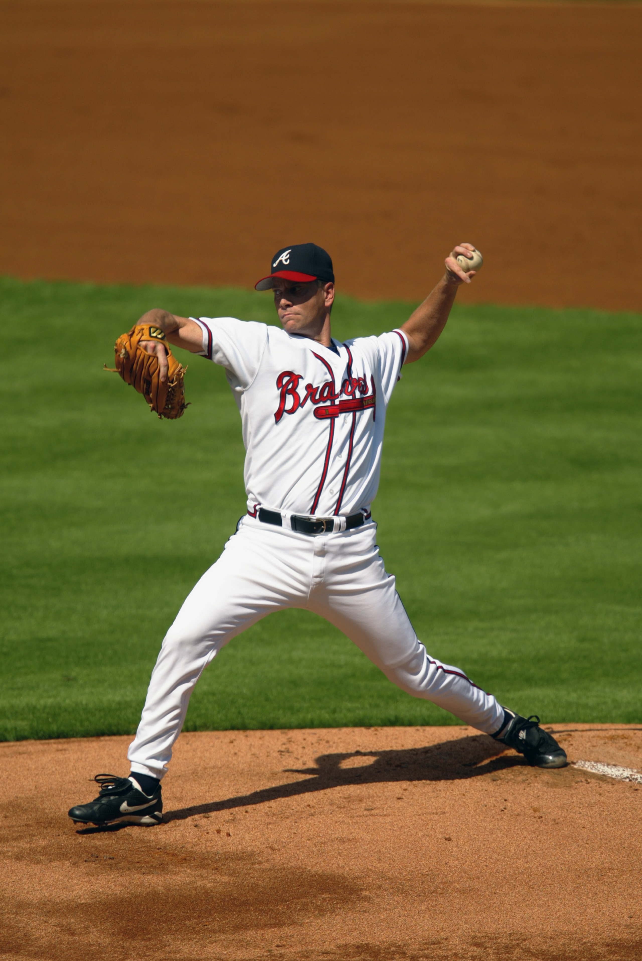 ATLANTA - OCTOBER 2:  Starting pitcher Tom Glavine #47 of the Atlanta Braves delivers a pitch in Game one of the National League Divisional Series against the San Francisco Giants at Turner Field on October 2, 2002 in Atlanta, Georgia. The Giants won 8-5.