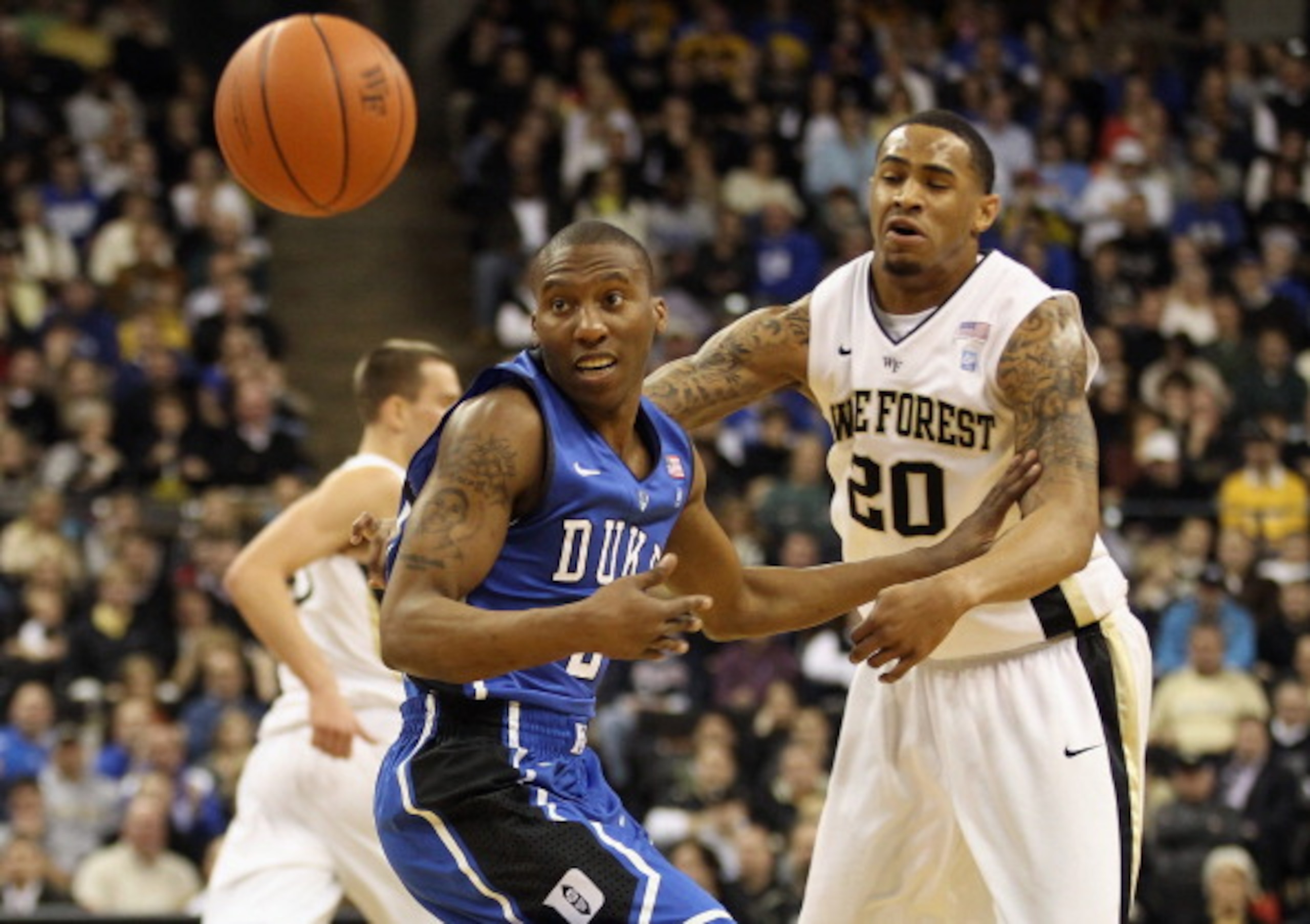 WINSTON SALEM, NC - JANUARY 22:  Nolan Smith #2 of the Duke Blue Devils goes after a loose ball with Ari Stewart #20 of the Wake Forest Demon Deacons during their game at Lawrence Joel Coliseum on January 22, 2011 in Winston Salem, North Carolina.  (Photo