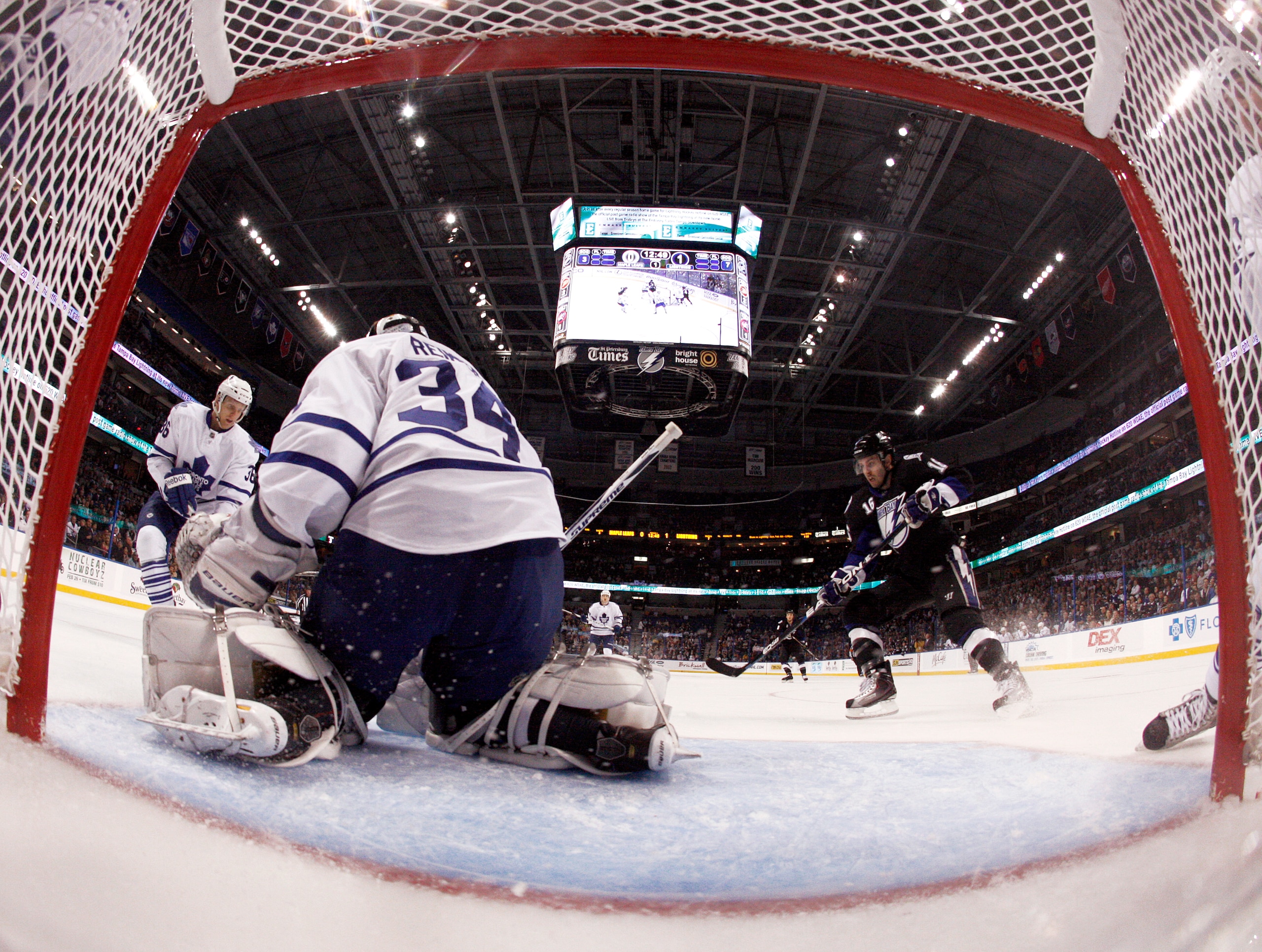TAMPA, FL - JANUARY 25: James Reimer #34 of the Toronto Maple Leafs makes a save as Teddy Purcell #16 of the Tampa Bay Lightning crashes the net at St. Pete Times Forum on January 25, 2011 in Tampa, Florida. The Lightning defeated the Leafs 2-0. (Photo by TAMPA, FL - JANUARY 25: James Reimer #34 of the Toronto Maple Leafs makes a save as Teddy Purcell #16 of the Tampa Bay Lightning crashes the net at St. Pete Times Forum on January 25, 2011 in Tampa, Florida. The Lightning defeated the Leafs 2-0. (Photo by