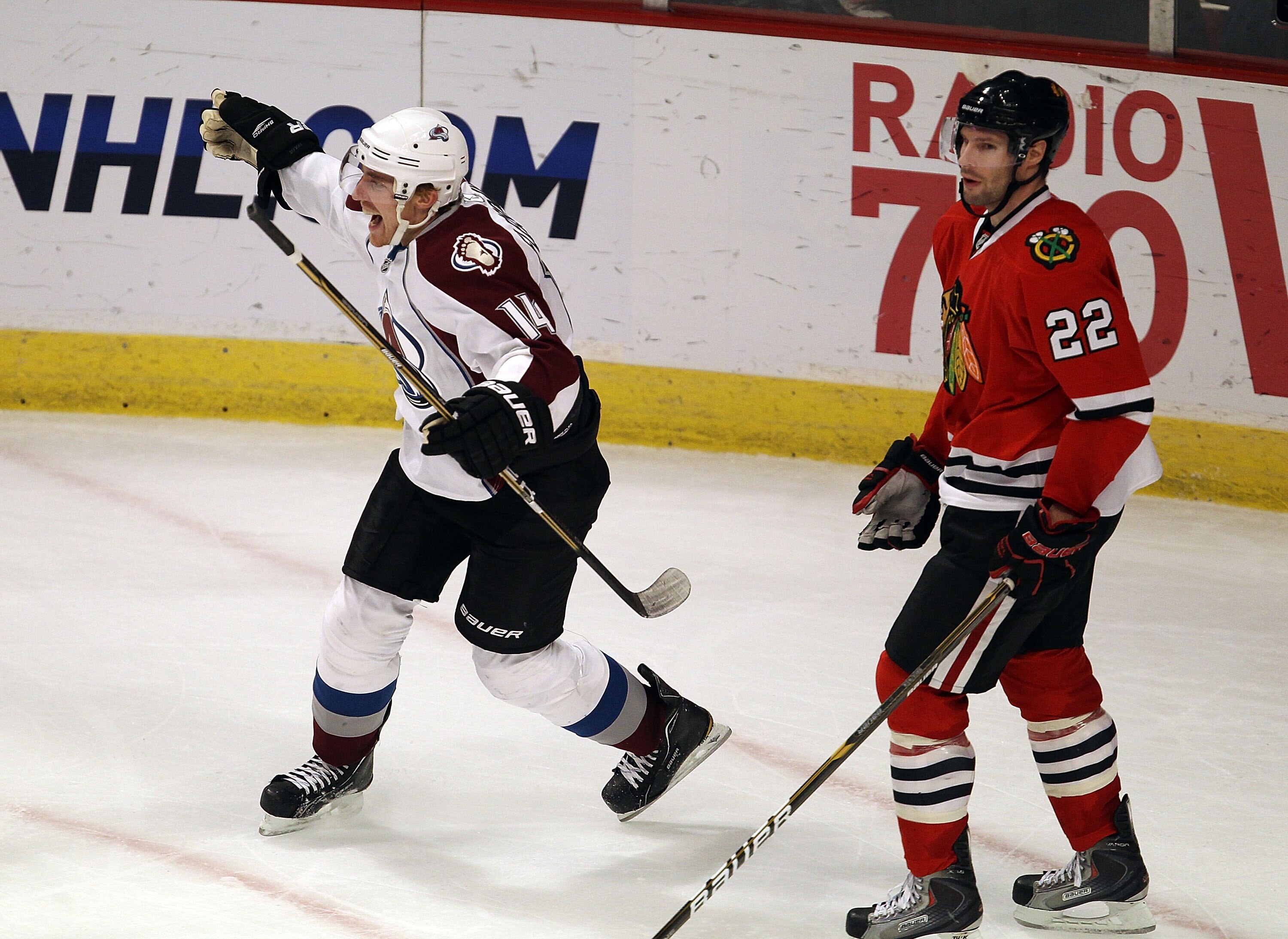 CHICAGO, IL - DECEMBER 15: Tomas Fleischmann #14 of the Colorado Avalanche celebrates his third goal of the game, all scored in the 3rd period, as he skates past Troy Brouwer #22 of the Chicago Blackhawks at the United Center on December 15, 2010 in Chica