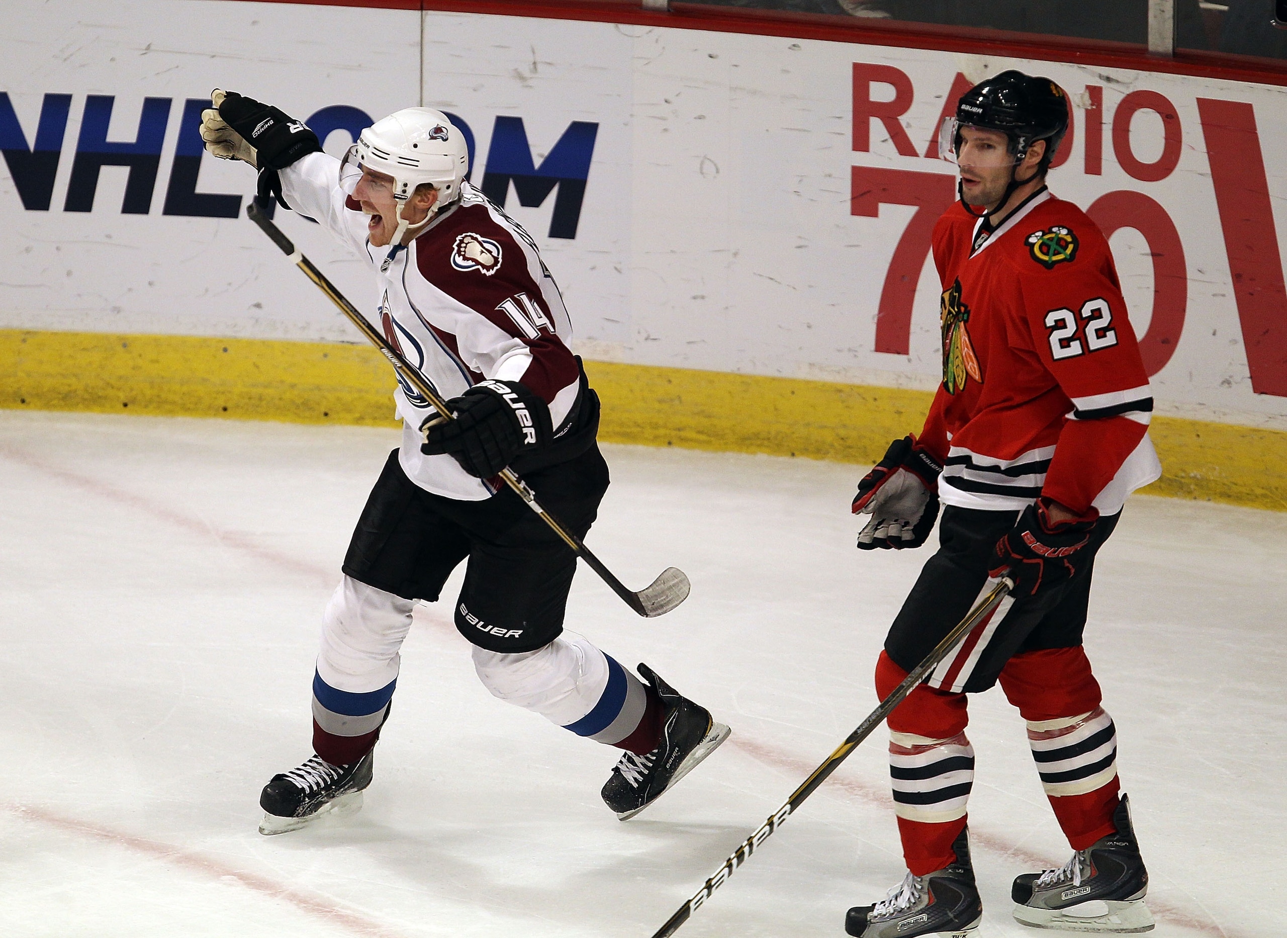 CHICAGO, IL - DECEMBER 15: Tomas Fleischmann #14 of the Colorado Avalanche celebrates his third goal of the game, all scored in the 3rd period, as he skates past Troy Brouwer #22 of the Chicago Blackhawks at the United Center on December 15, 2010 in Chica