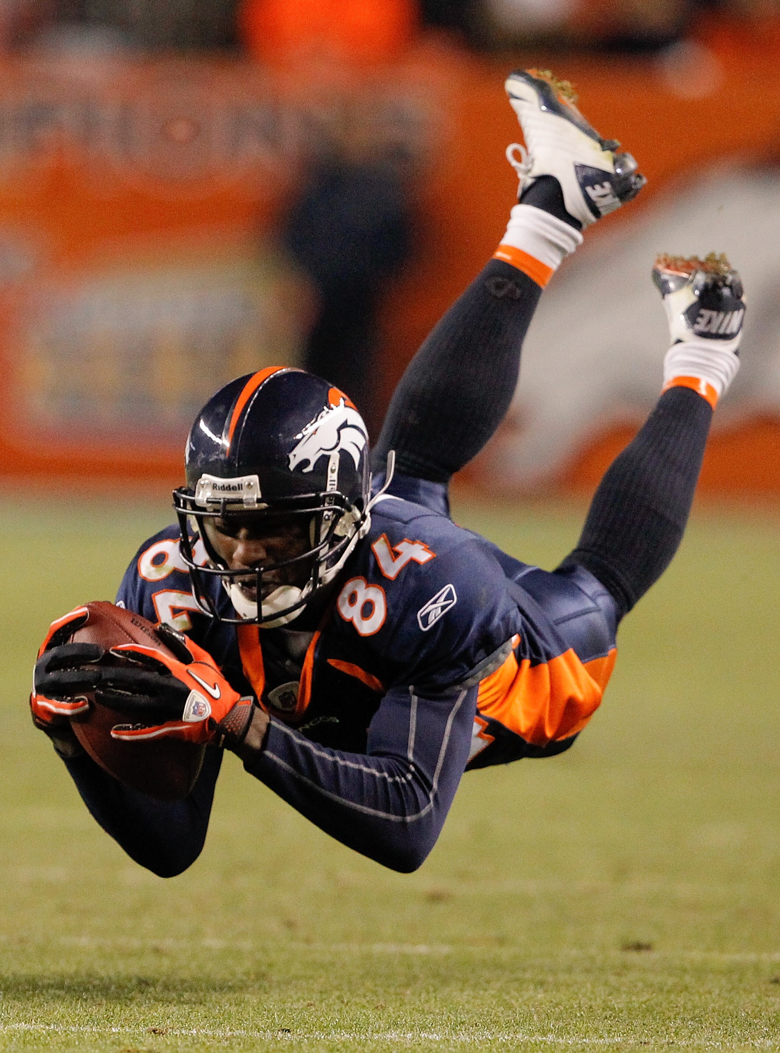 DENVER - NOVEMBER 28: A pass from Kyle Orton slips through the fingertips of wide receiver Brandon Lloyd #84 of the Denver Broncos during the fourth quarter against the St. Louis Rams at INVESCO Field at Mile High on November 28, 2010 in Denver, Colorado DENVER - NOVEMBER 28: A pass from Kyle Orton slips through the fingertips of wide receiver Brandon Lloyd #84 of the Denver Broncos during the fourth quarter against the St. Louis Rams at INVESCO Field at Mile High on November 28, 2010 in Denver, Colorado